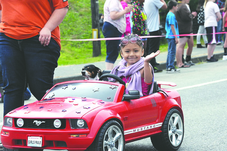Simona Cruz of Clallam Bay rides in the Kids Parade with her dog Poopy during the 2012 Clallam Bay-Sekiu Fun Days. Lonnie Archibald/for Peninsula Daily News