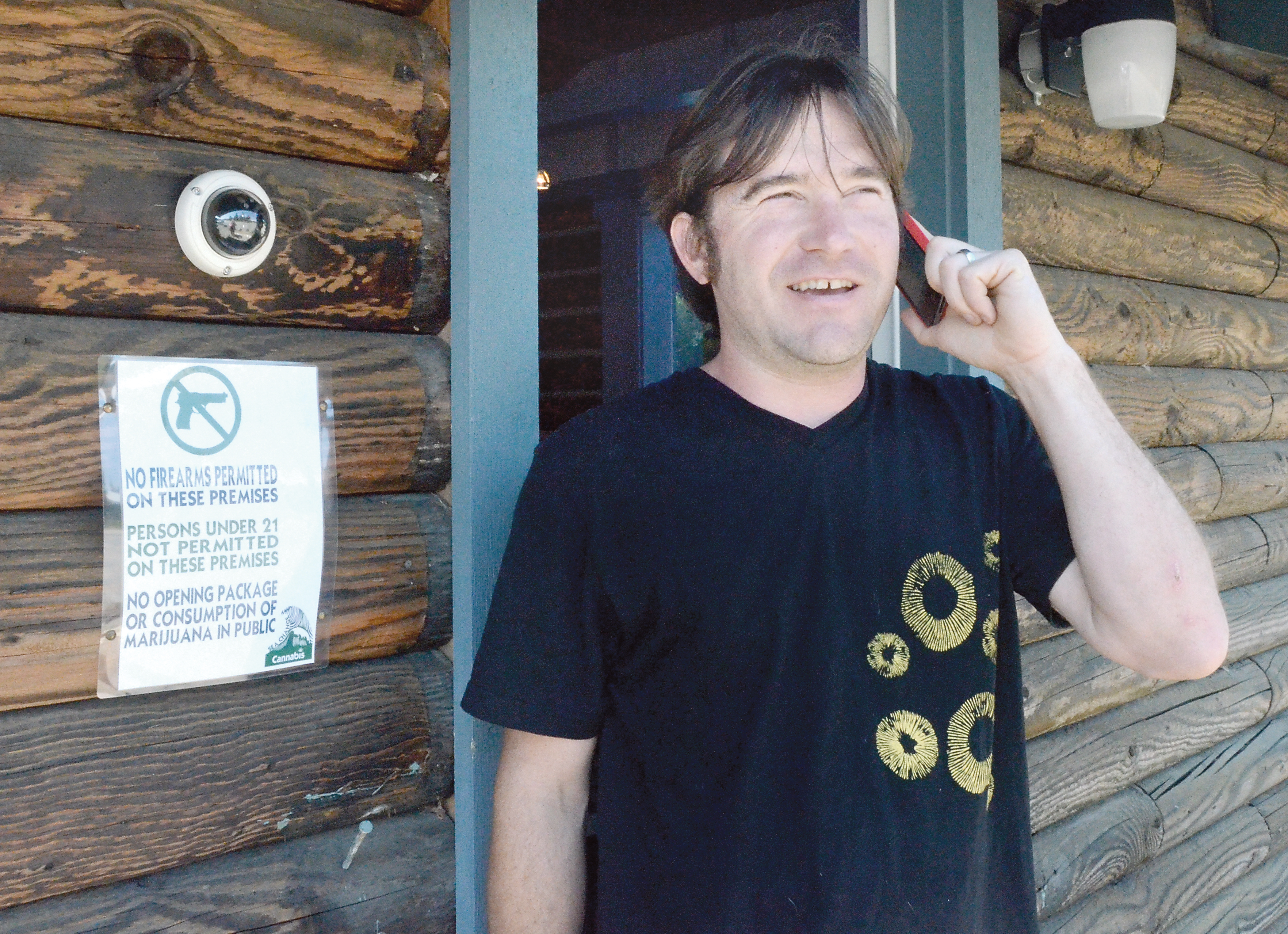 Greg Brotherton talks to a supplier in preparation for the eventual opening of Sea Change Cannabis. Charlie Bermant/Peninsula Daily News