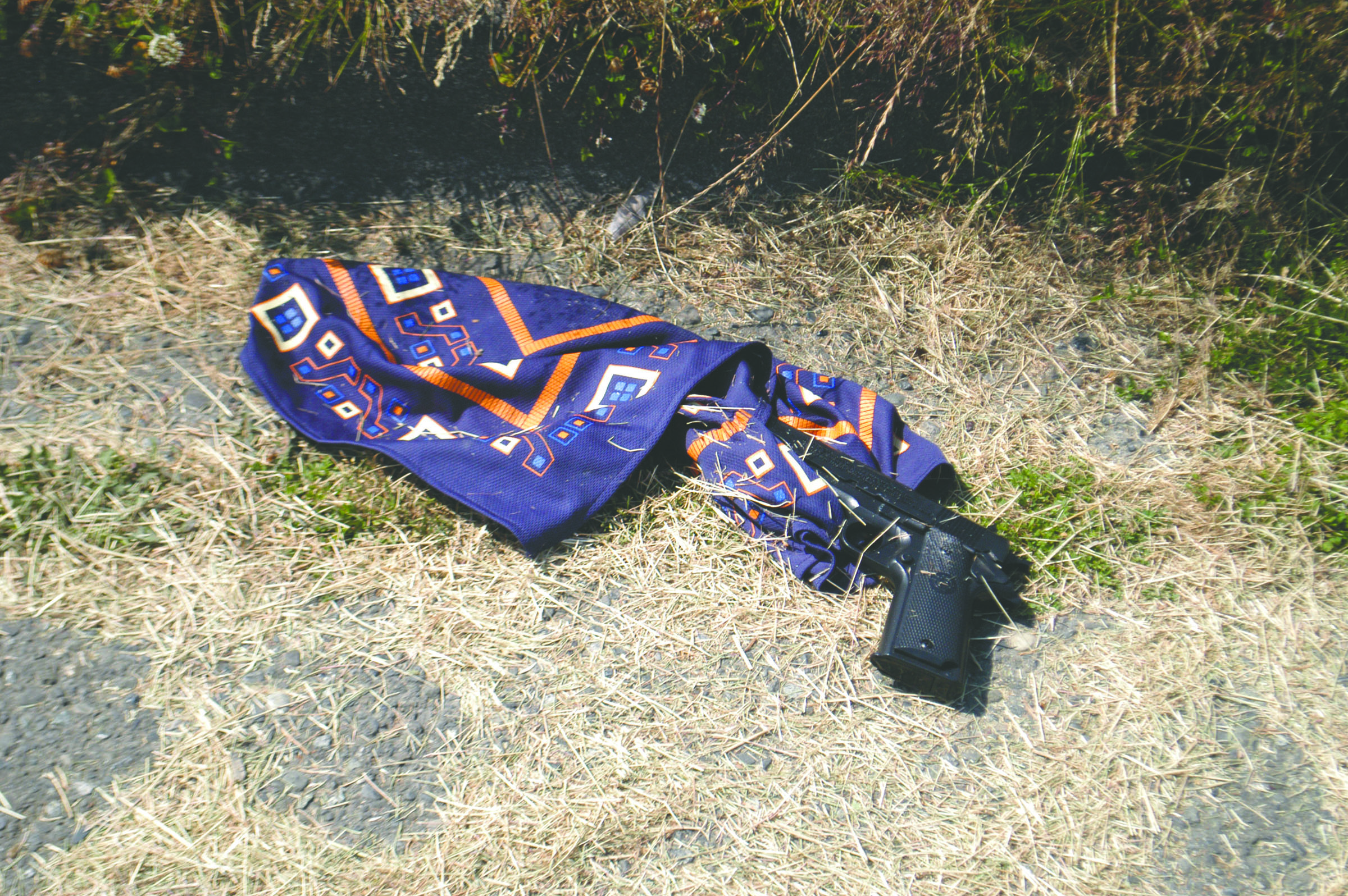 Plastic gun and scarf believed used by the robber. Rob Ollikainen/Peninsula Daily News
