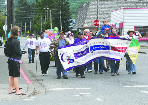 Walkers with the Forks Relay For Life march toward the junction of East Division Street and Forks Avenue in downtown Forks in 2011. Lonnie Archibald/for Peninsula Daily News