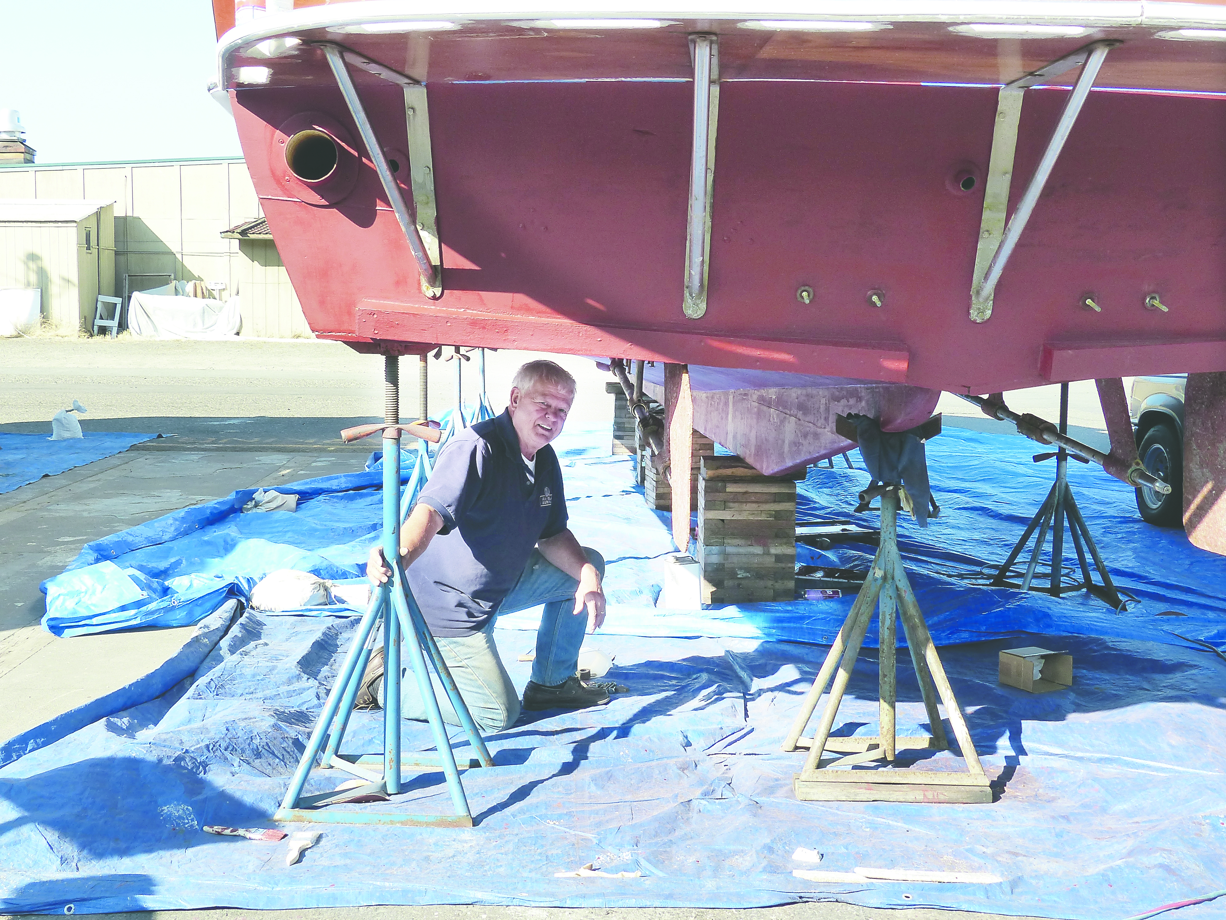 Al Davis beneath the hull of Pearl in the Port Angeles Boatyard. David G. Sellars/for Peninsula Daily News