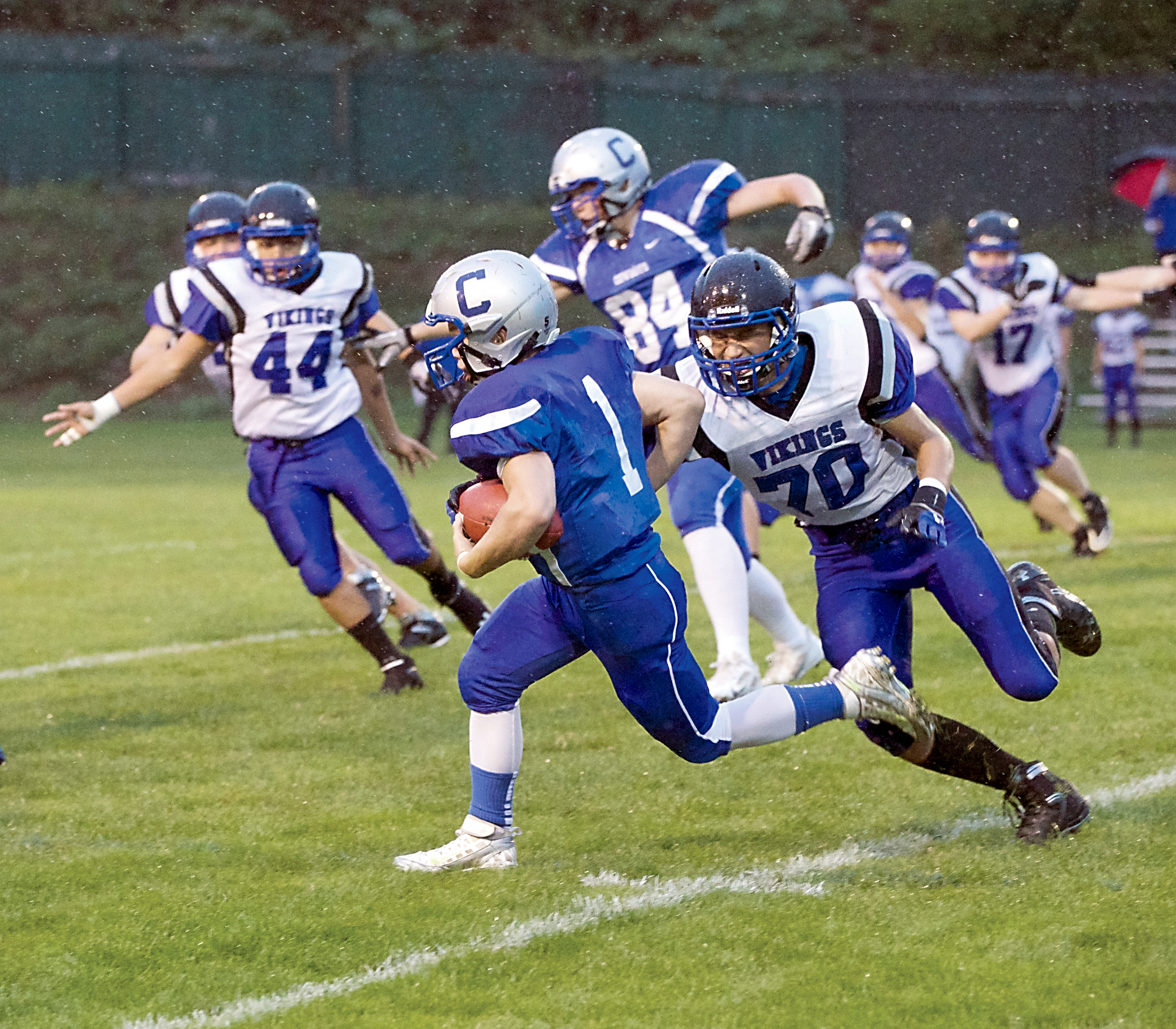 Chimacum's Drew Yackulic (1) runs for yardage against the Bellevue Christian Vikings last season. Yackulic will be a senior for the new-look Cowboys. Steve Mullensky/for Peninsula Daily News