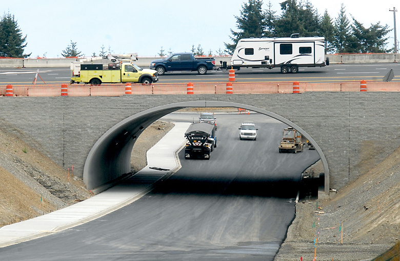 Traffic on U.S. Highway 101 makes its way across a span over the new Deer Park Loop underpass Thursday after it was opened as a temporary detour during paving on Buchanan Road east of Port Angeles. Keith Thorpe/Peninsula Daily News