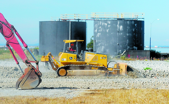 A bulldozer works on the site of the former Rayonier paper mill in Port Angeles on Tuesday. Keith Thorpe/Peninsula Daily News