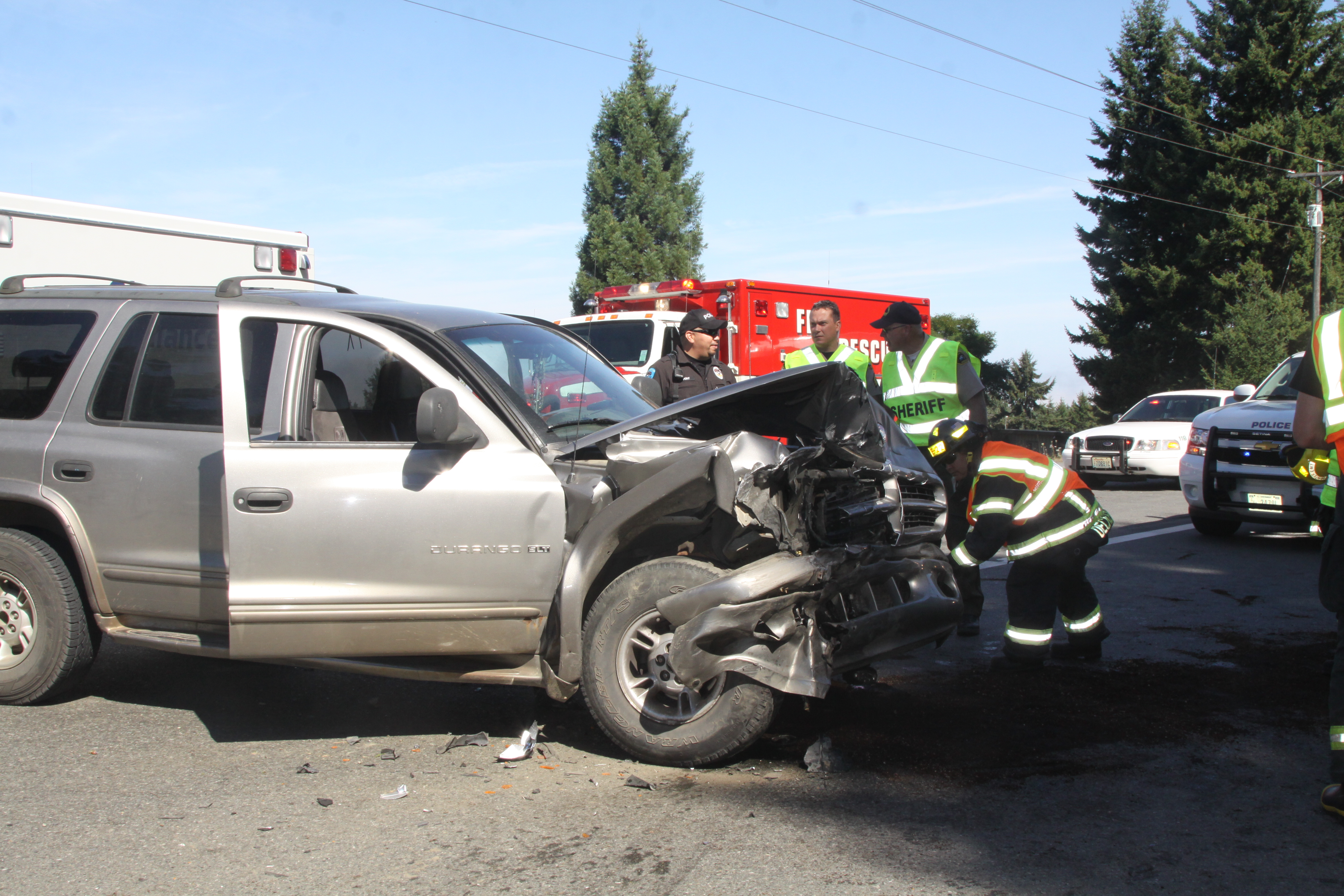 Emergency crews respond to the scene of Sunday's collision at the junction of Highways 101 and 112 west of Port Angeles. Dave Logan/for Peninsula Daily News