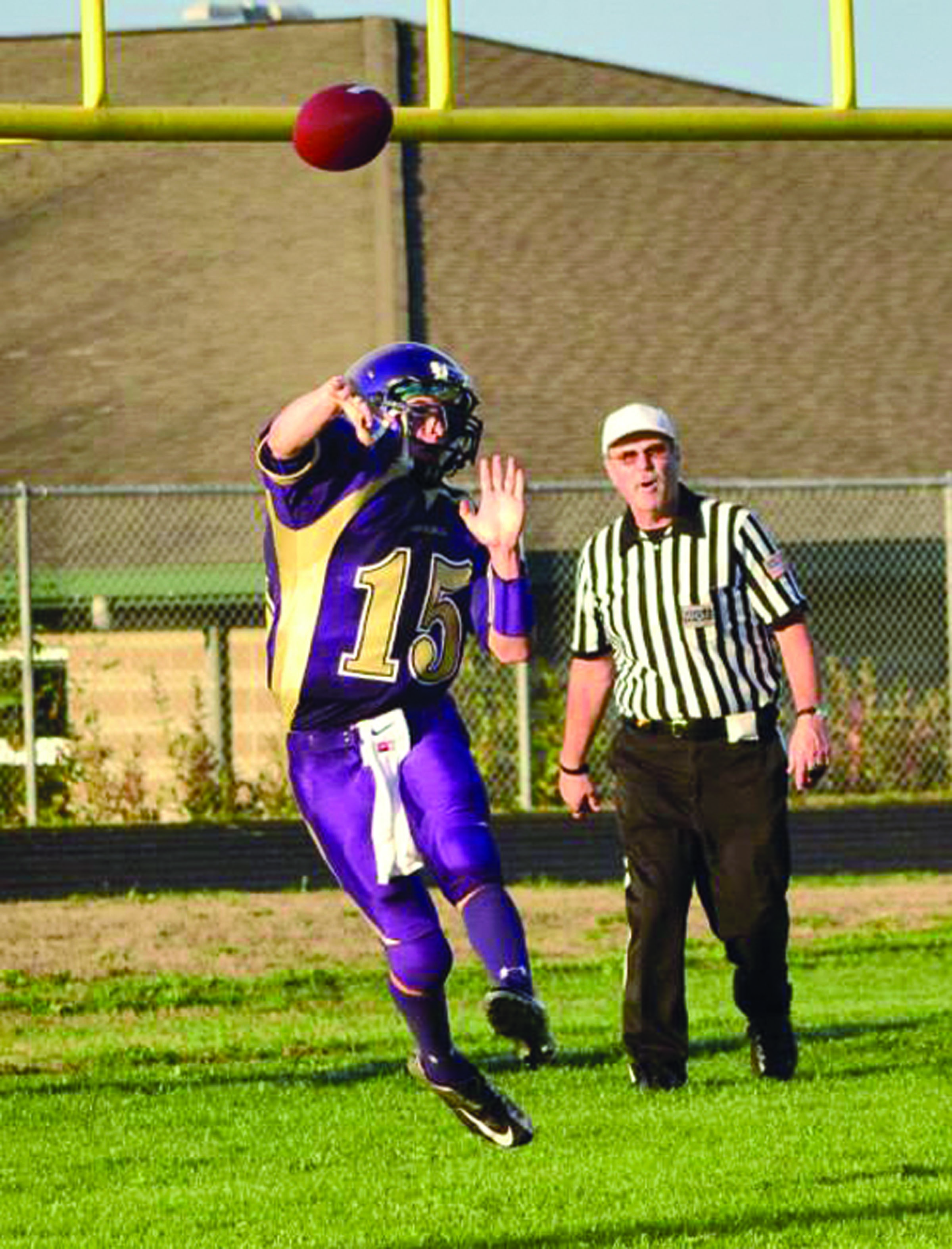 Sequim quarterback Miguel Moroles throws the ball from his own end zone during the Wolves' 35-20 loss to New Westminster