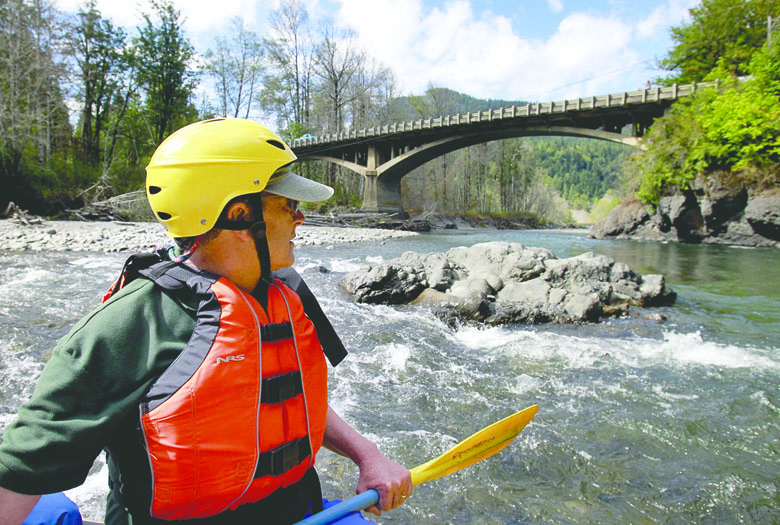 Rob Smith approaches the U.S. Highway 101 bridge on the Elwha River near an area that was underwater before Elwha Dam was removed in 2012. Tacoma News Tribune