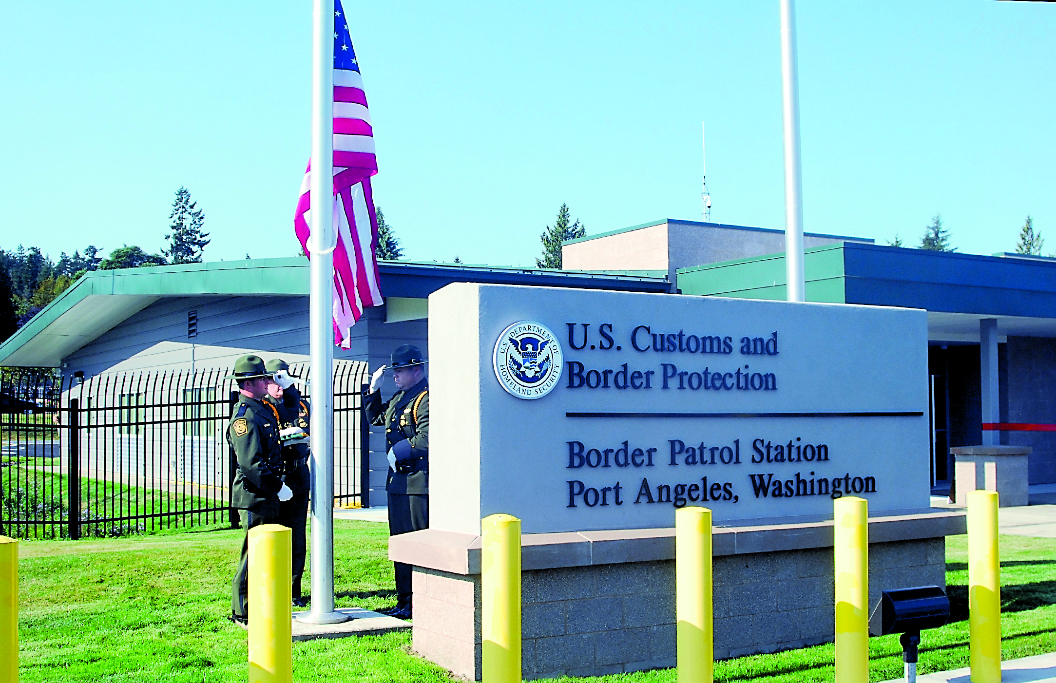 A color guard from the U.S. Border Patrol Blaine Sector raises the U.S. flag in front of the new Port Angeles station. Keith Thorpe/Peninsula Daily News