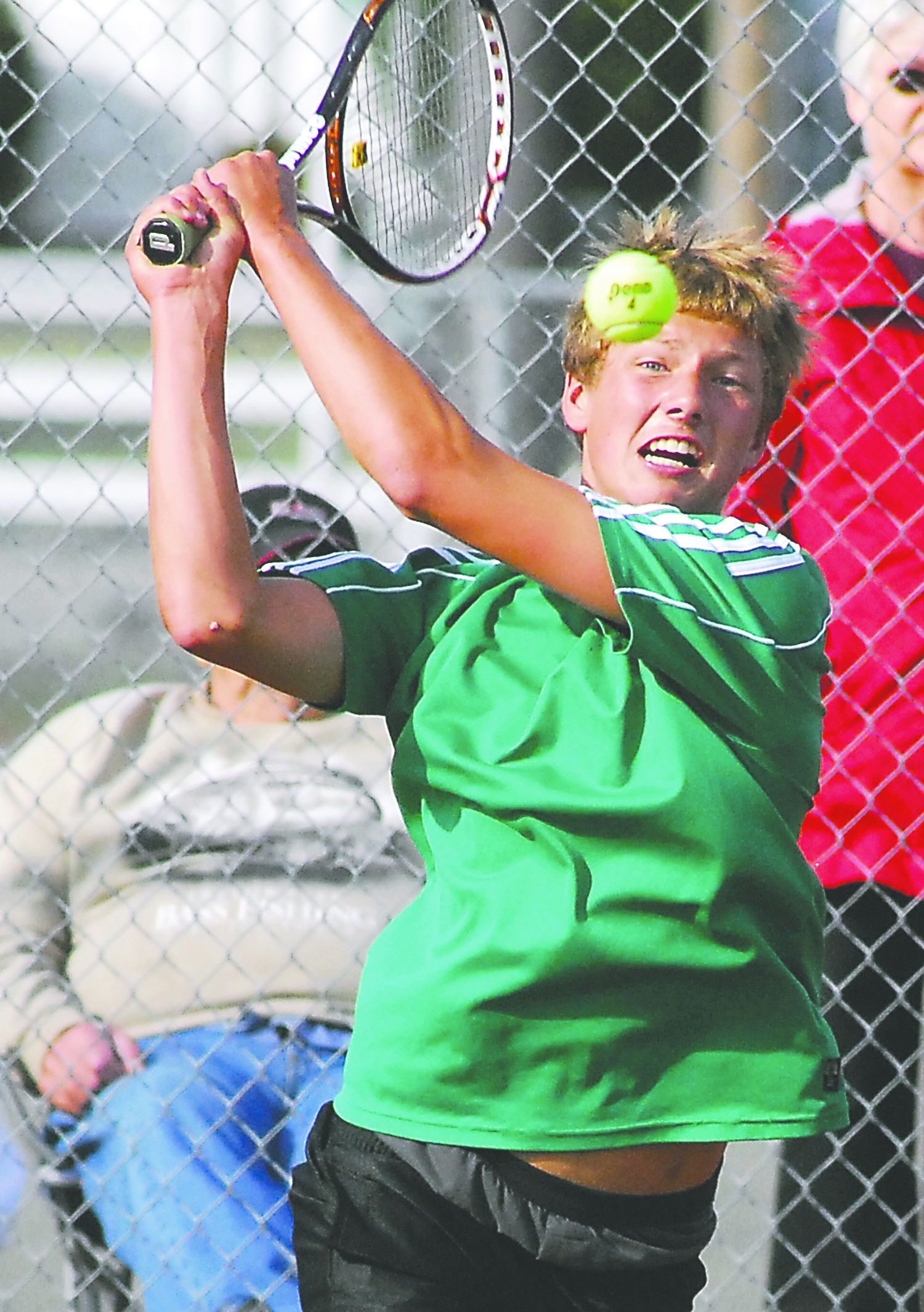 Port Angeles' Alex Brown returns a serve in his match against Klahowya's Jerry Landram. Keith Thorpe/Peninsula Daily News