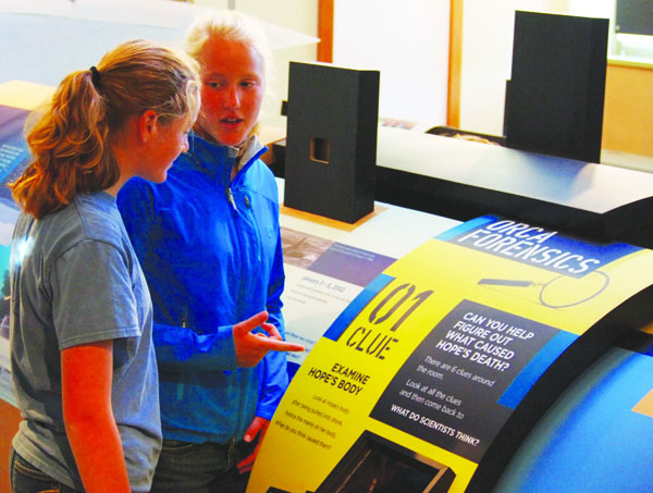 Chloe and Eliza Dawson use clues to find out what killed the orca named Hope at the Port Townsend Marine Science Center. Wendy Feltham