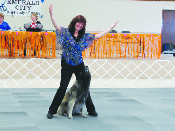 Lori McKenna of Enumclaw dances with her dog