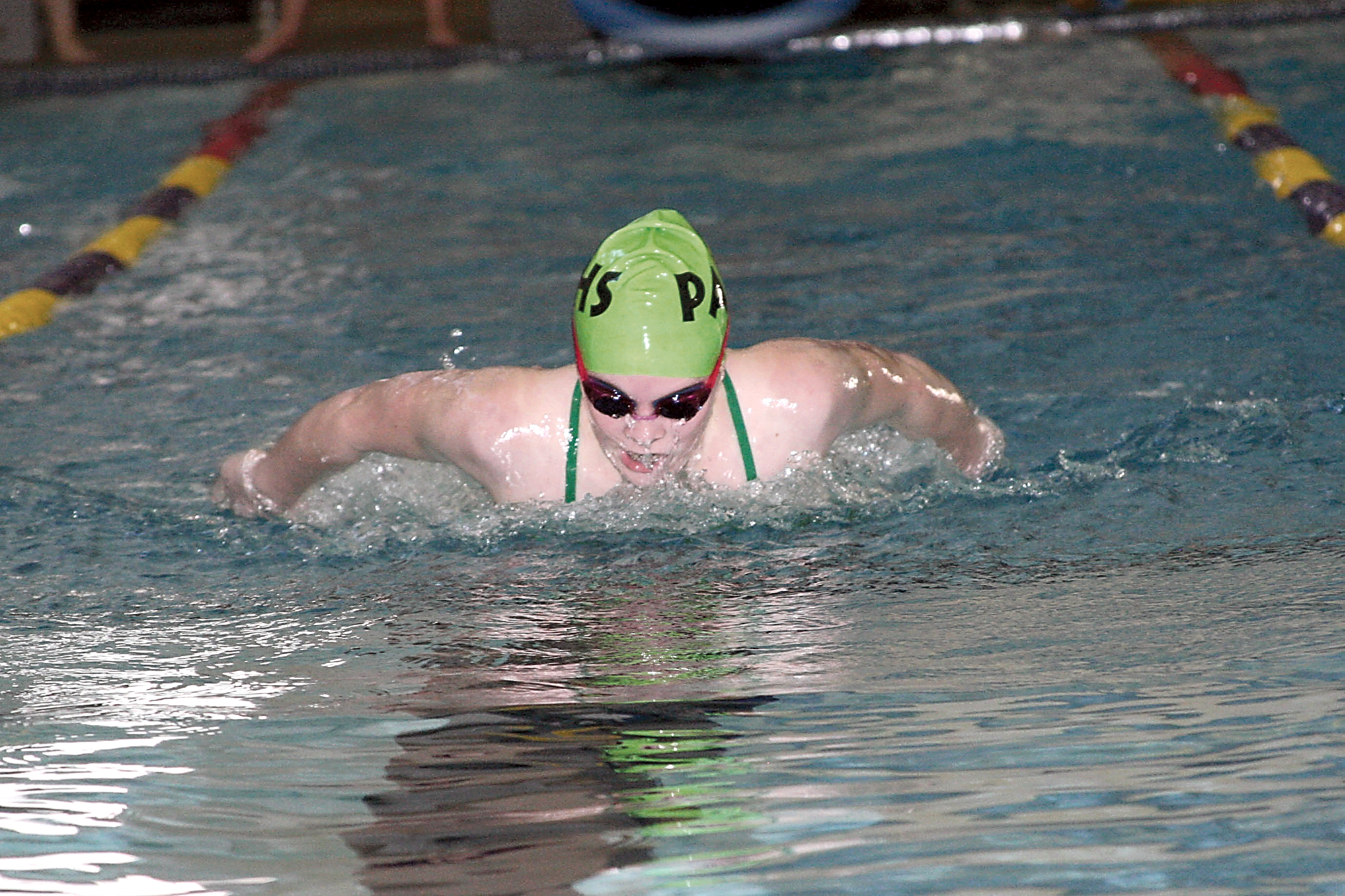 ort Angeles' Taylor Beebe swims a district-qualifying time in the 100 butterfly at Sequim Aquatic Recreation Center. Patty Reifenstahl