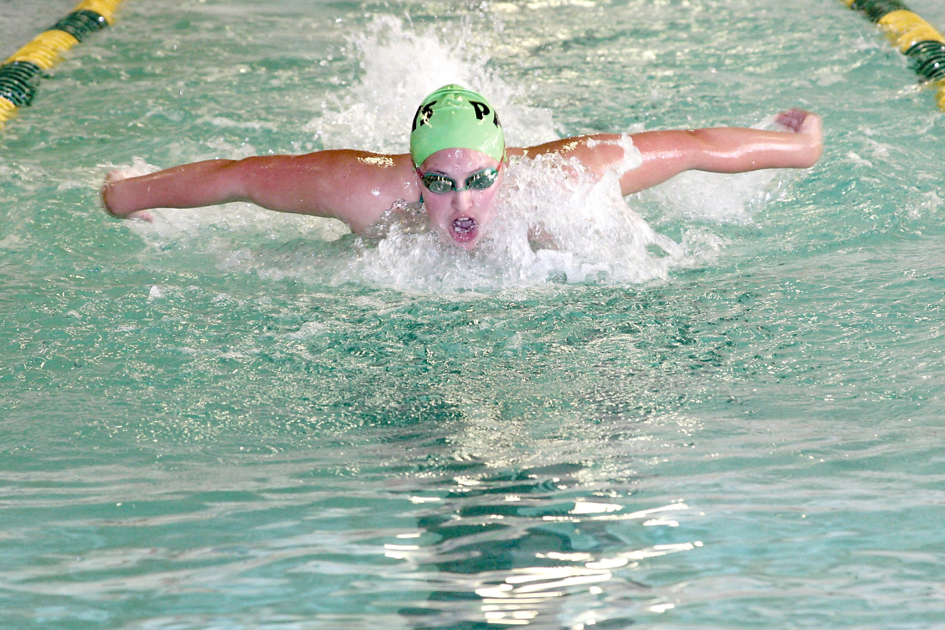 Janie Macias swims the 100-yard butterfly for Port Angeles at Williams Shore Memorial Pool. Patty Reifenstahl
