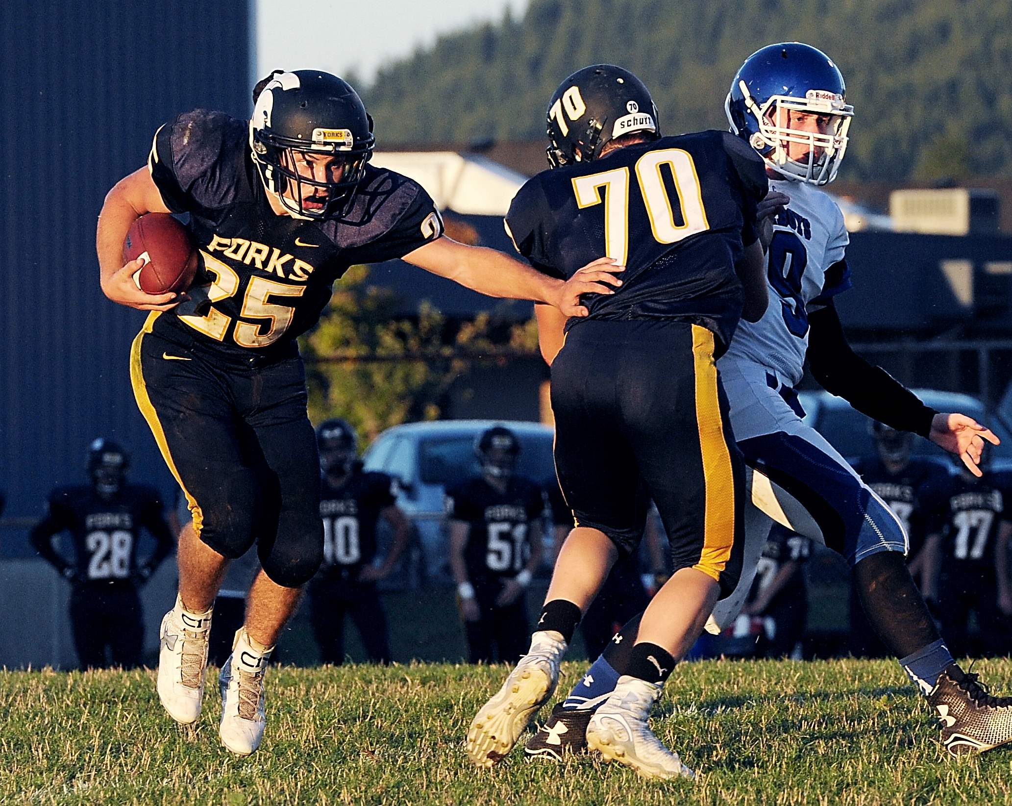 Forks running back Kenny Gale against Chimacum behind the block of Jack Dahlgren last month. Lonnie Archibald/for Peninsula Daily News