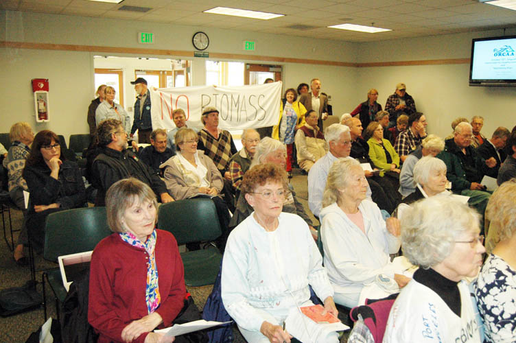 People pack the Sequim Transit Center Monday to sound off to the Olympic Region Clean Air Agency about the planned biomass plants in Port Angeles and Port Townsend. Paul Gottlieb/Peninsula Daily News