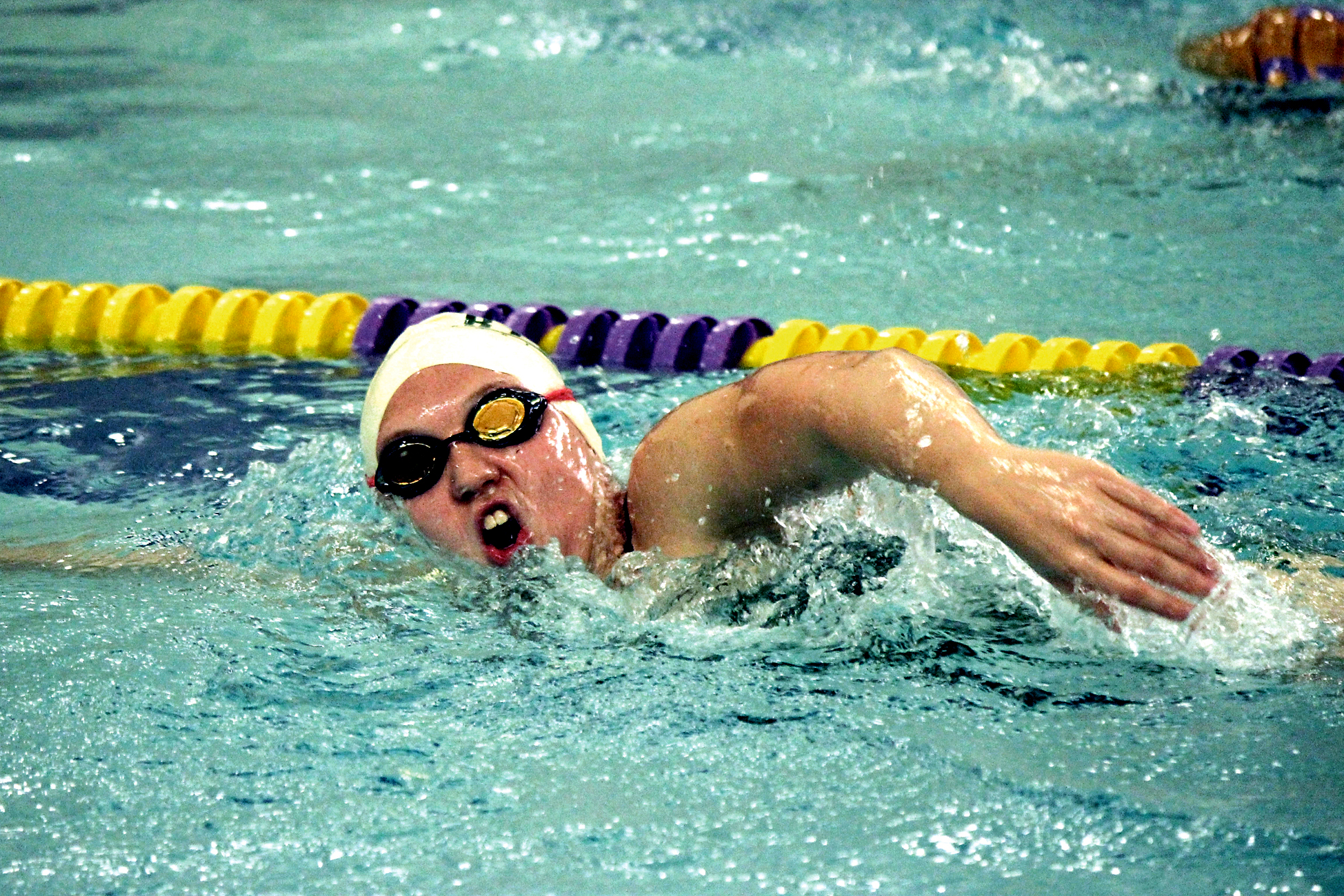 Carter Juskevich swims freestyle for Port Angeles in its league win over North Kitsap. Patty Reifenstahl