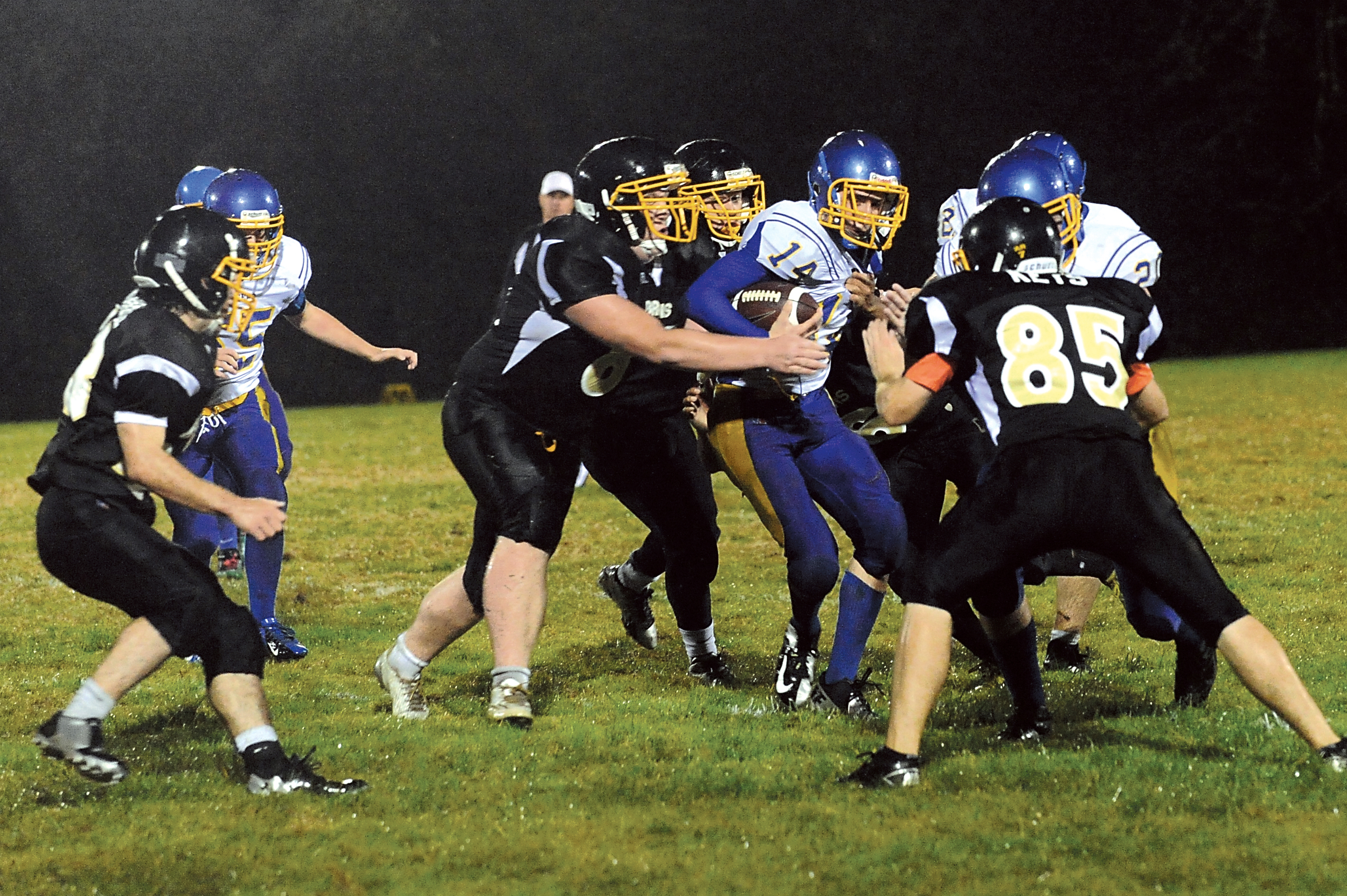 Crescent's Zach Fletcher (14) is surrounded by