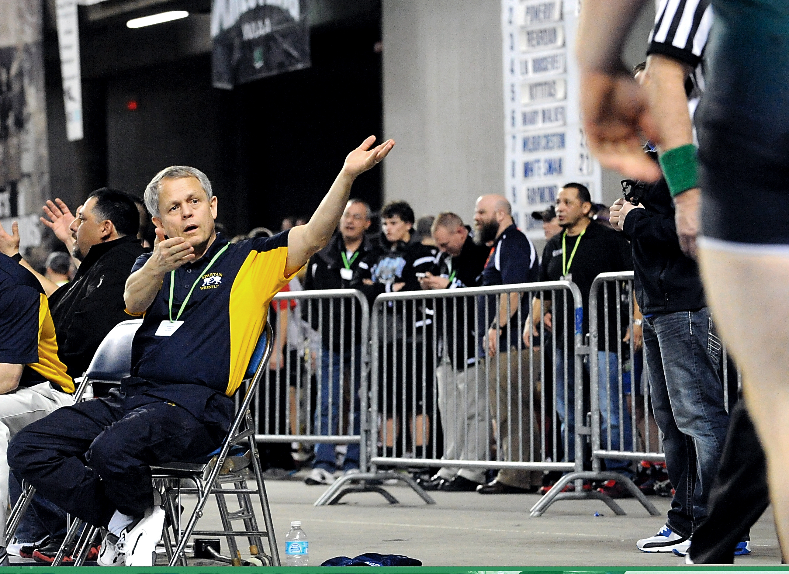 Forks wrestling coach Bob Wheeler gestures during Mat Classic XXV at the Tacoma Dome in 2013. Wheeler will be inducted into the Washington State Wrestling Coaches Association Hall of Fame on Saturday. Lonnie Archibald/for Peninsula Daily News