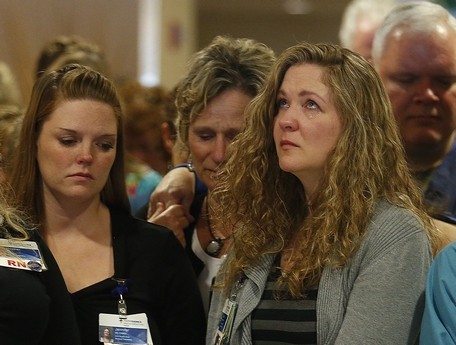 A group of registered nurses observes a moment of silence with their fellow  caregivers at 10:39 a.m. Monday at Providence Regional Medical Center Everett. Staff at the hospital initially received all four of the victims of Friday's shooting at Marysville Pilchuck High School before two patients were transferred to Harborview Medical Center in Seattle. The (Everett) Herald