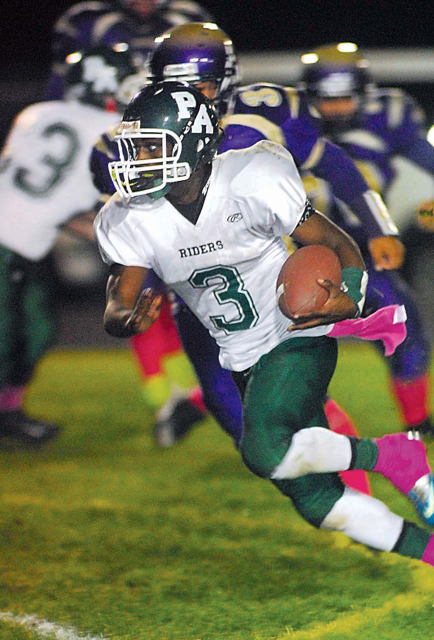 Port Angeles' Miki Andrus rushes upfield against Sequim. Andrus scored two touchdowns to help the Roughriders defeat their rivals 37-21. Keith Thorpe/Peninsula Daily News