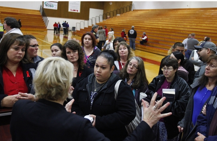 Marysville School District parents speak to Superintendent Dr. Becky Berg on Tuesday night after a community meeting at Marysville Pilchuck High School. Local school and community officials spoke to parents and answered questions regarding the school's plan to reopen in light of the shooting. The (Everett) Herald