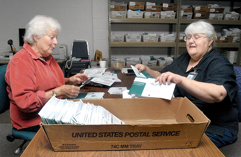 Election volunteers Mary Reader of Port Angeles