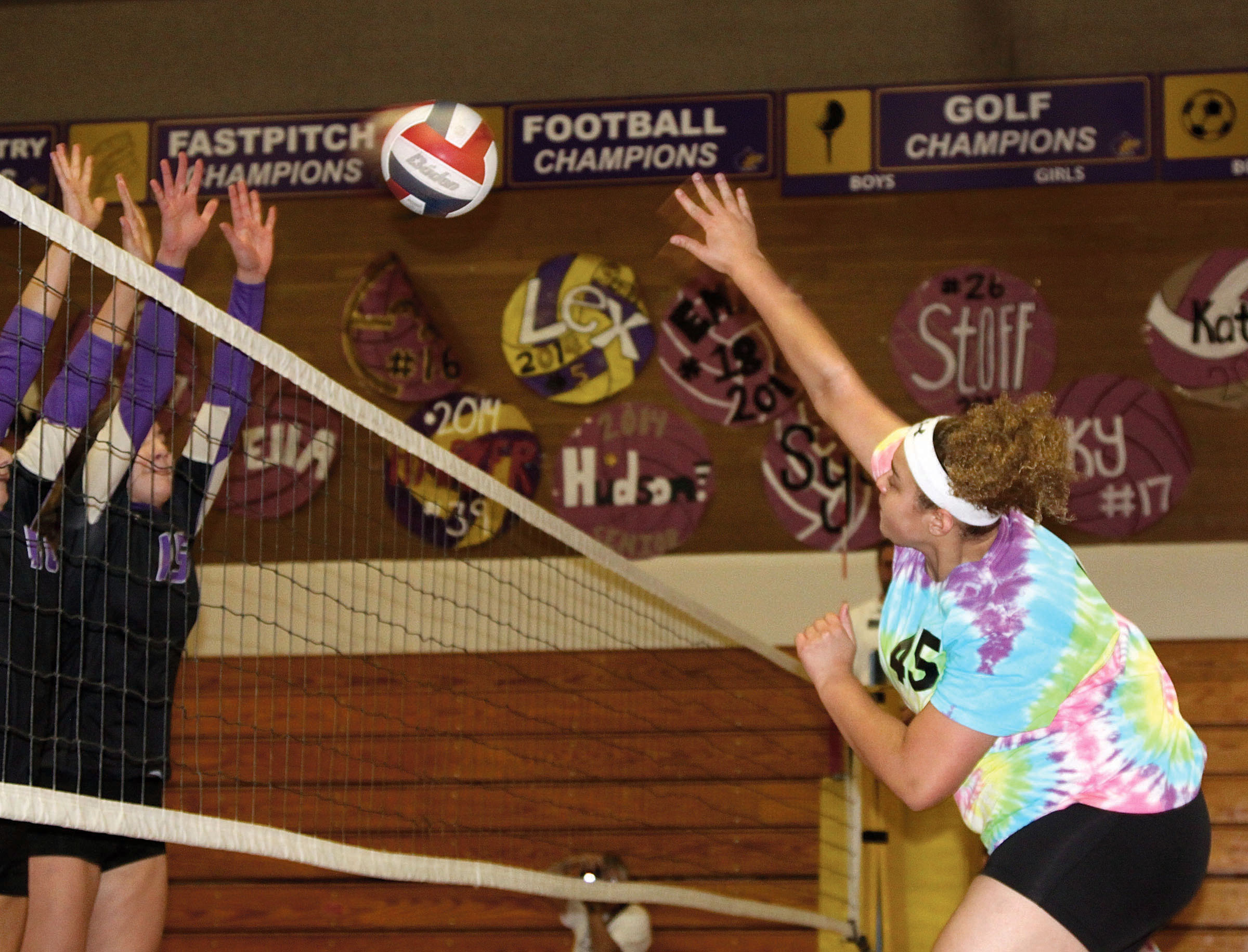 Lex Besand of Sequim smashes the volleyball into the defense of North Kitsap during the Olympic League championship match at Sequim High School. Dave Logan/for Peninsula Daily News