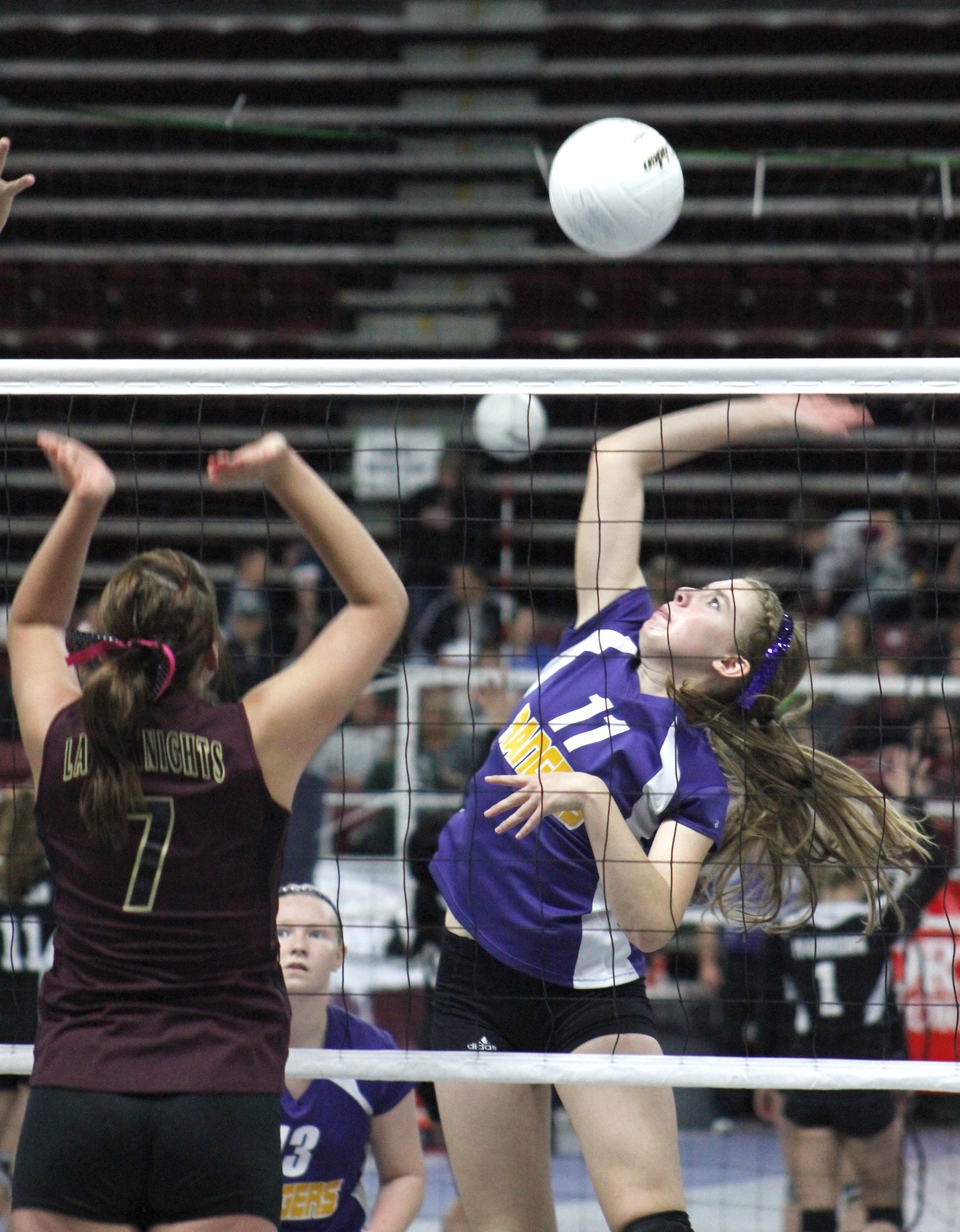 Quilcene's Megan Weller attempts a spike against Sunnyside Christian's Mackenzie Benjert during last year's Class 1B state volleyball tournament in Yakima. Roger Harnack/The Omak-Okanogan County Chronicle