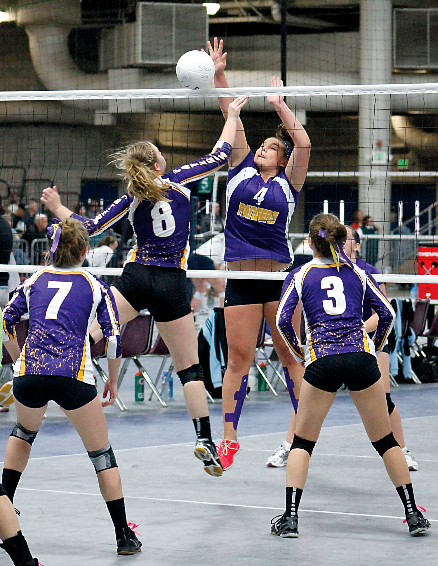 Quilcene junior Sammy Rae (4) blocks a spike attempt by Pateros senior Chloe Gill (8) during the opening round of the state 1B volleyball tournament. Roger Harnack/The Omak-Okanogan County Chronicle