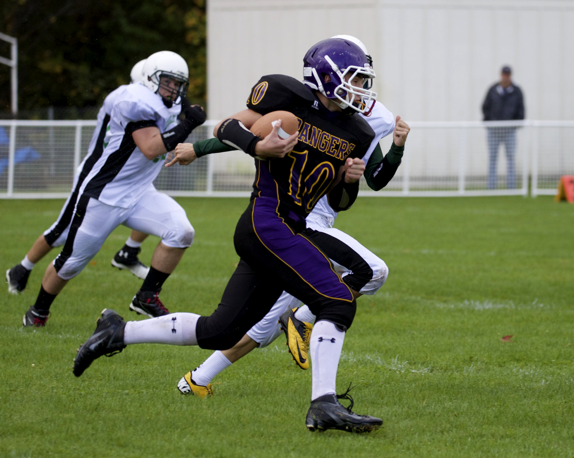 Quilcene's A.J. Prater turns the corner and runs for a first down against Evergreen Lutheran last month. Prater and the Rangers travel to face Lummi in the state quarterfinals Saturday. Steve Mullensky/for Peninsula Daily News