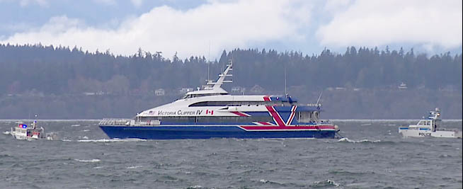 Law enforcement boats surround the drifting Victoria Clipper IV in Elliott Bay off Seattle this morning. KOMO
