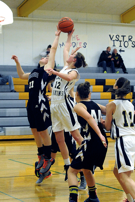 Quilcene's Abby Weller (11) and Clallam Bay's Molly McCoy (12) vie for the rebound.  Also in on the action is Quilcene's Katlyn Hitt (44) and Clallam Bay's Shelby Willis. Lonnie Archibald/for Peninsula Daily News