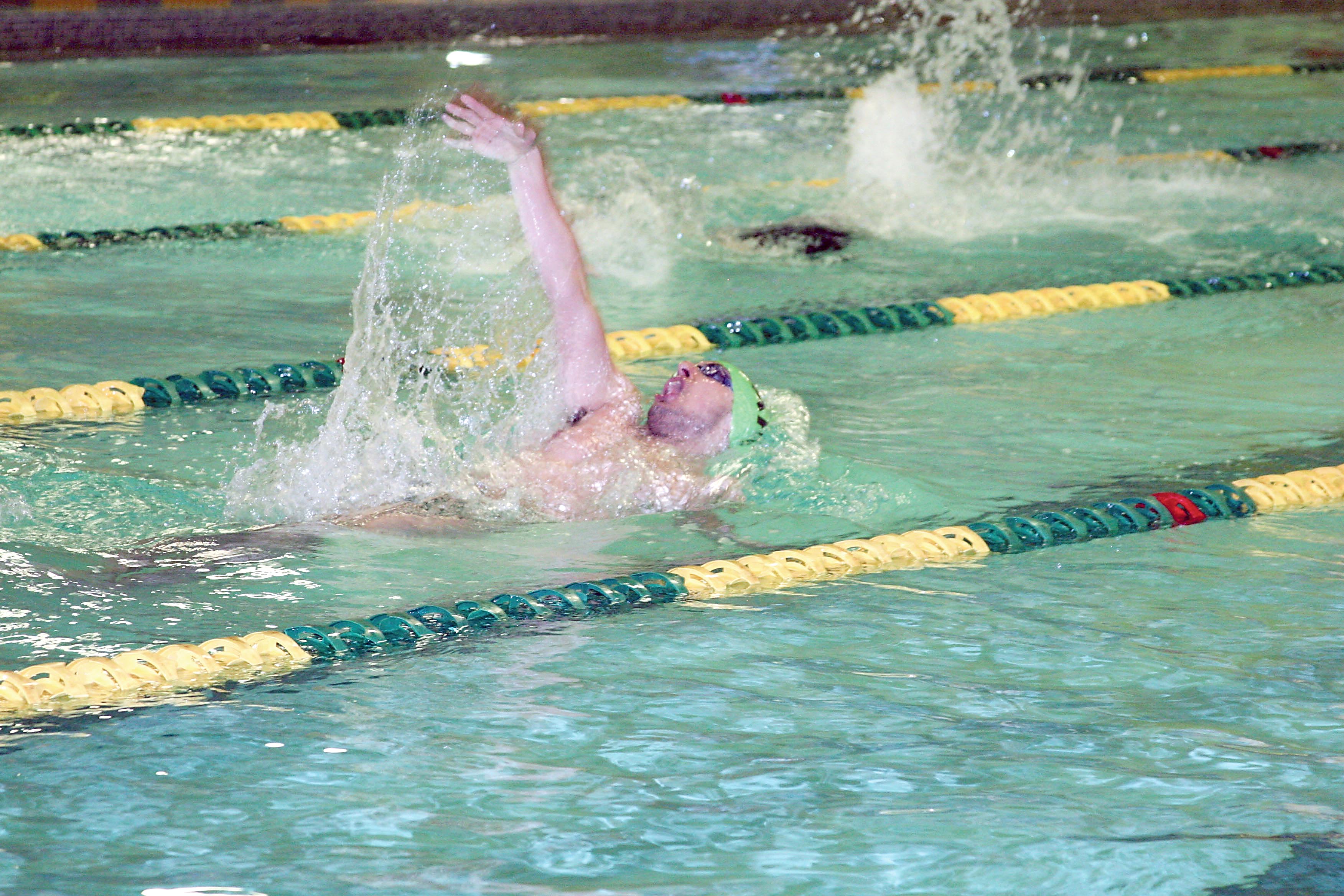 John Macias broke the Port Angeles High School record in the 100-yard backstroke that had stood since 1982 during Thursday's meet against Sequim at William Shore Memorial Pool. Patty Reifenstahl
