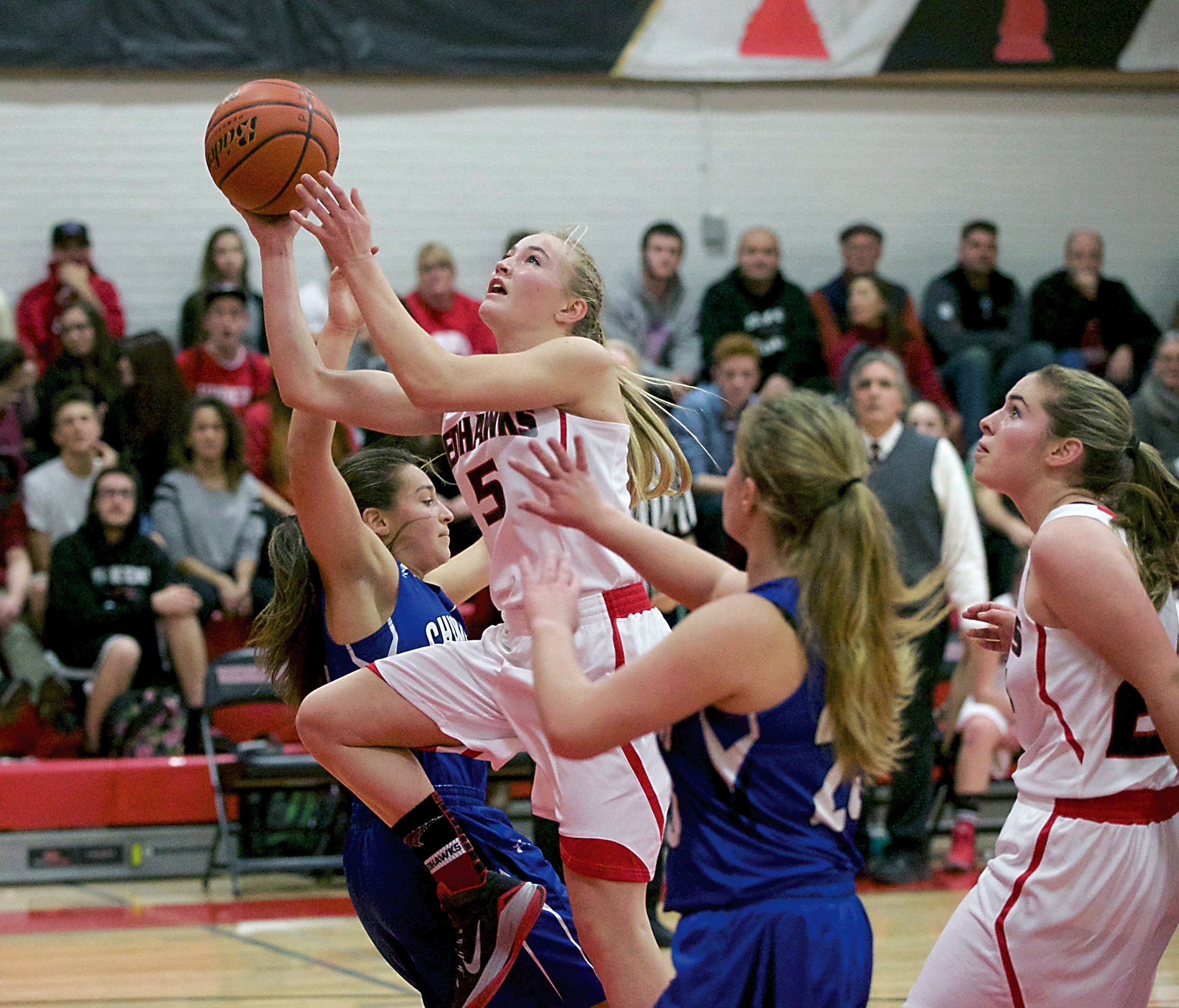 Port Townsend's Kaitlyn Meek goes up for a basket against Chimacum. Meek led all scorers with 21 points to lead the Redhawks to victory. Steve Mullensky/for Peninsula Daily News