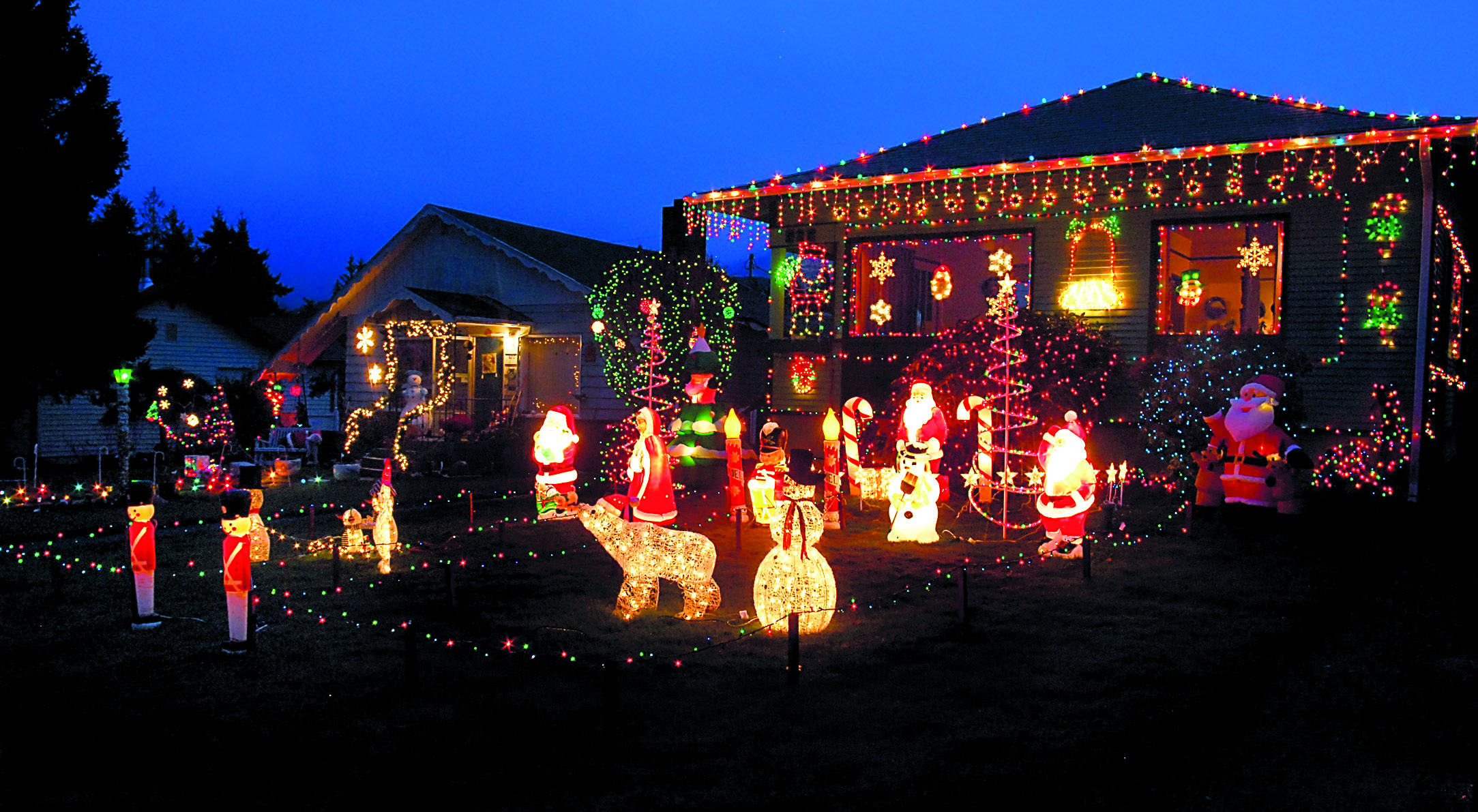 Neighboring houses in the 800 block of East Ninth Street in Port Angeles are featured on this year's Christmas lights tour by All Points Charters & Tours. Keith Thorpe/Peninsula Daily News