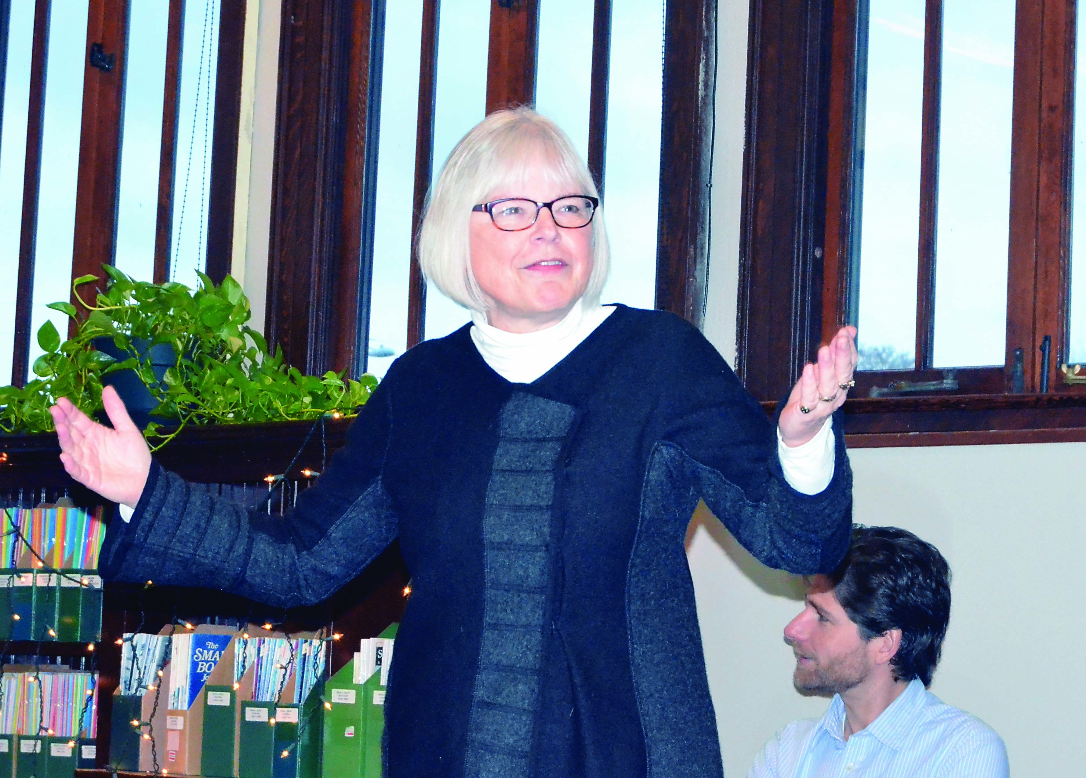 Port Townsend Library Adult Services Director Cris Wilson addresses the Library Board in a presentation about the plans to move back into the Carnegie Building. Technical Services Director Keith Darrock is in the background.  -- Photo by Charlie Bermant/Peninsula Daily News