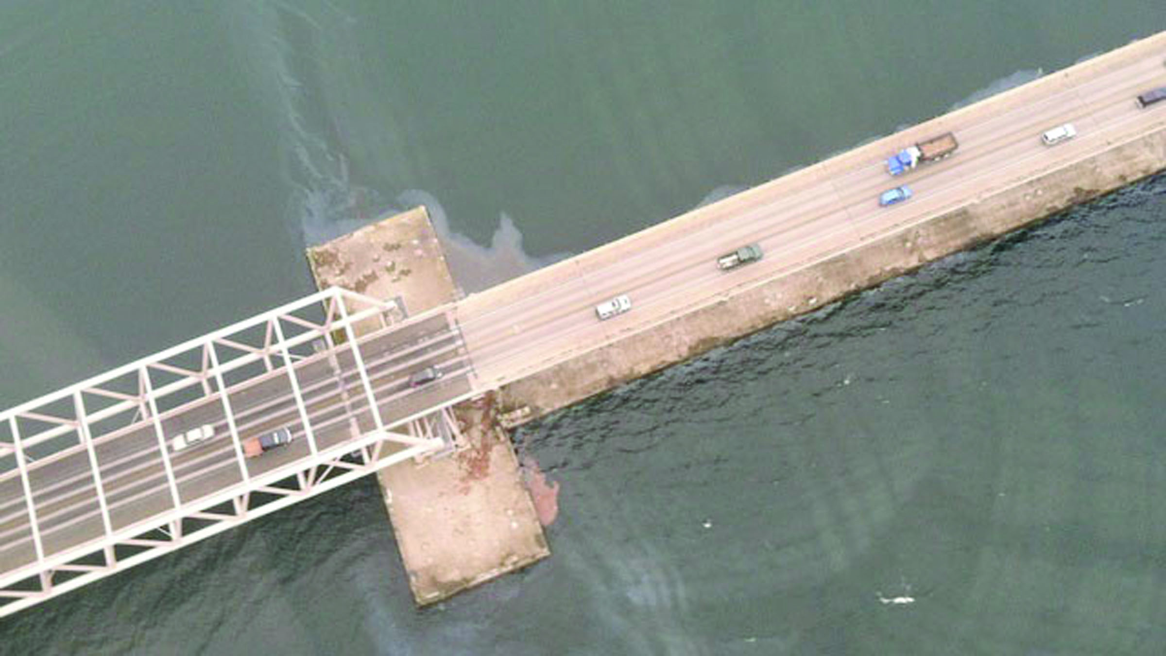 The sheen from Mondays oil spill is visible at the Hood Canal Bridge during a flyover by the Washington Department of Ecology.  Washington Department of Ecology