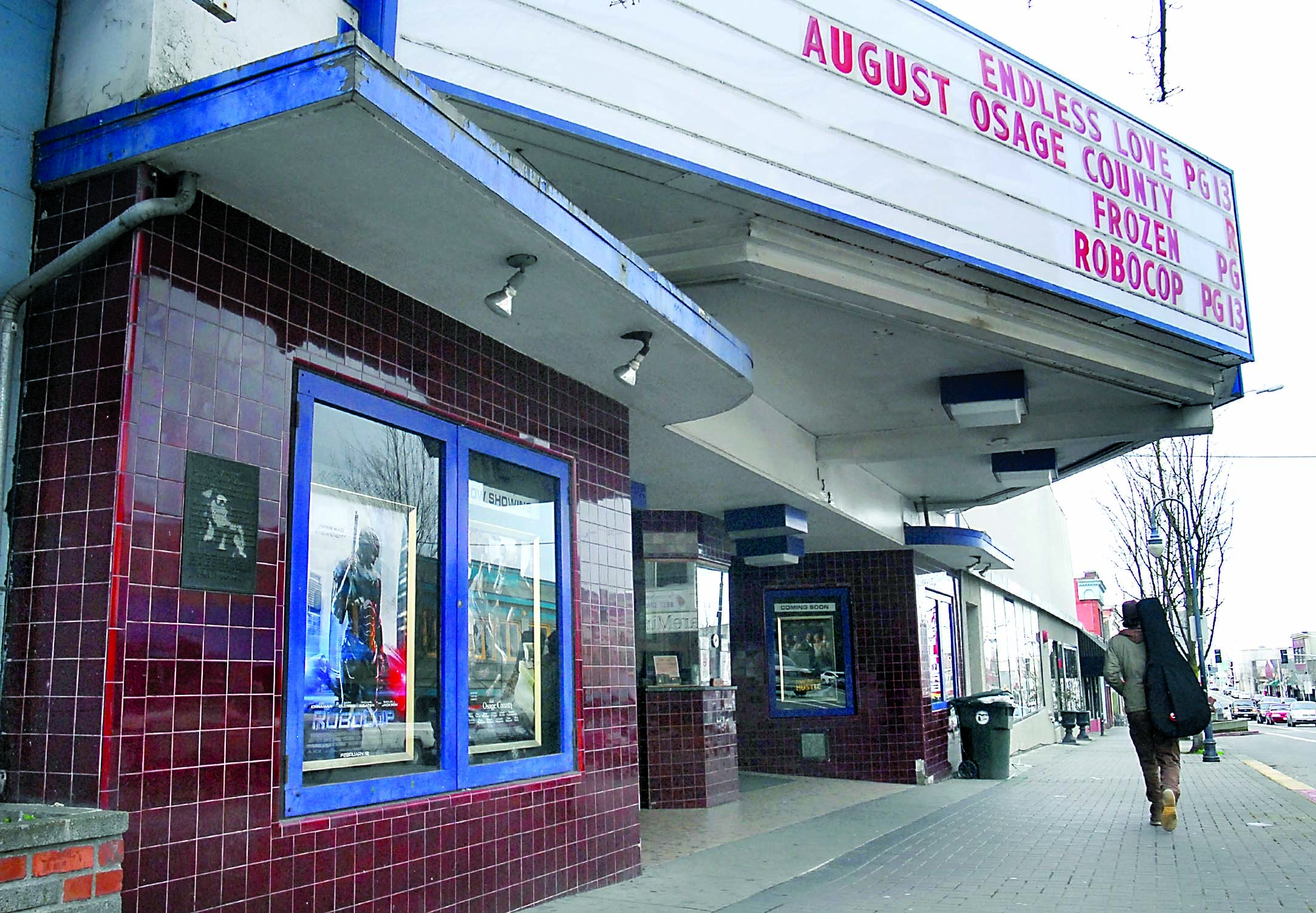 Posters of current movies are displayed in front of the Lincoln Theater in Port Angeles on Wednesday as the marquee advertises the last movies to be shown in the 98-year-old cinema. — Keith Thorpe/Peninsula Daily News