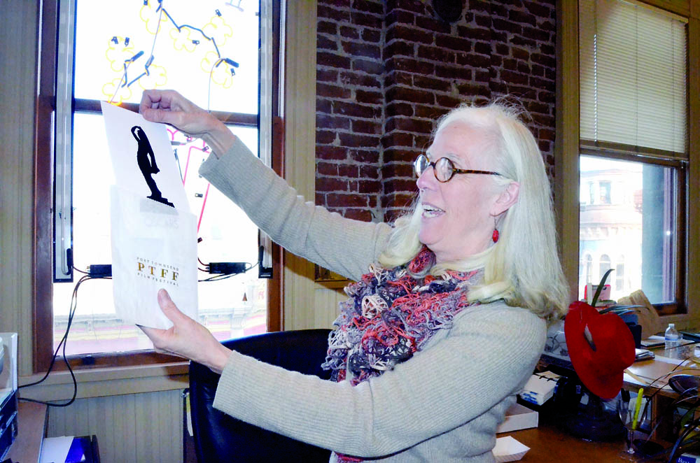 Port Townsend Film Festival Executive Director Janette Force displays the tickets for Sunday's Oscar celebration at the Northwest Maritime Center