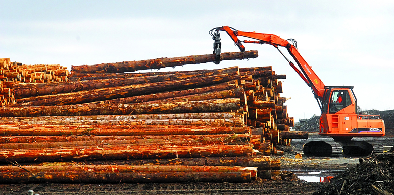 A loader stacks logs at the Port of Port Angeles log yard on Marine Drive west of Port Angeles Boat Haven on Wednesday. Keith Thorpe/Peninsula Daily News