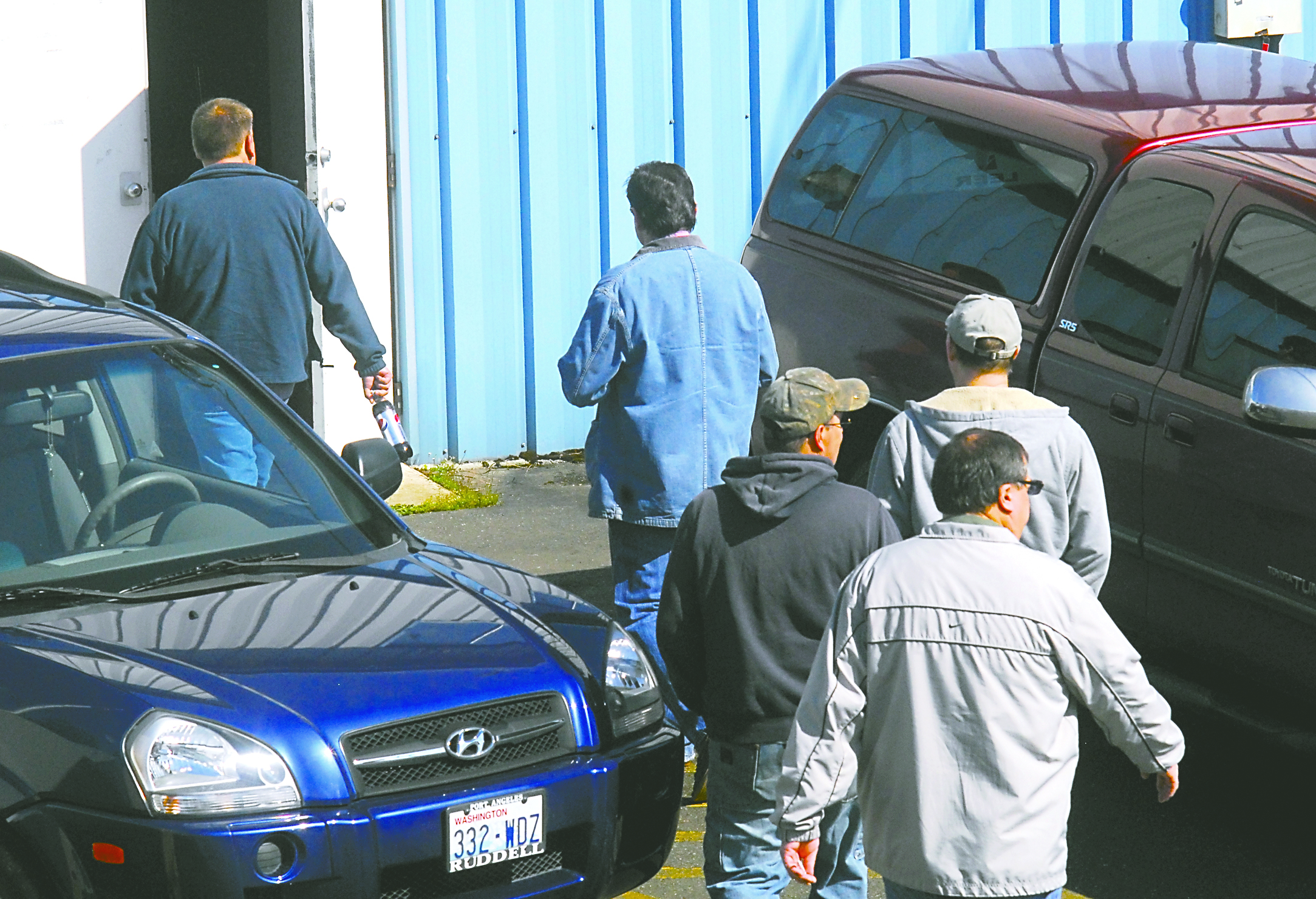 Unionized employees of the Nippon Paper Industries USA mill file into a meeting at the Moose Lodge in Port Angeles on Saturday for a briefing by the Association of Western Pulp & Paper Workers.  -- Photo by Keith Thorpe/Peninsula Daily News