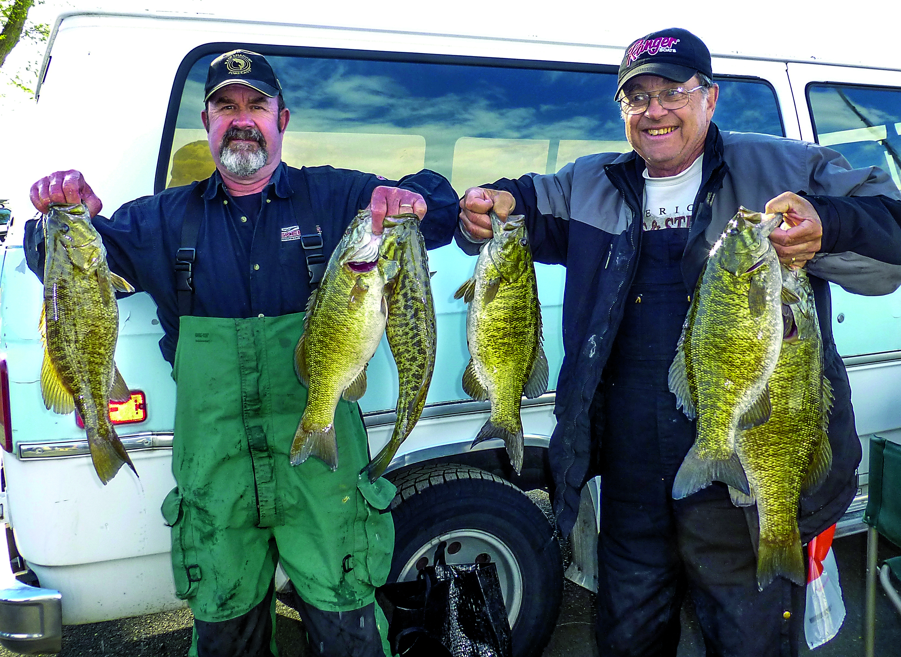 Roger Mosley of Joyce and his friend Bob Steiner of Poulsbo hold up their catch of smallmouth bass from day one of the 35th annual Potholes Open Bass Tournament near Moses Lake.