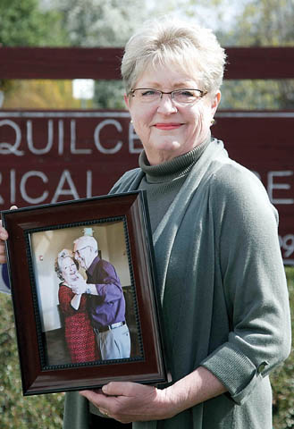 Carol Christianson with a photo of her and her late husband