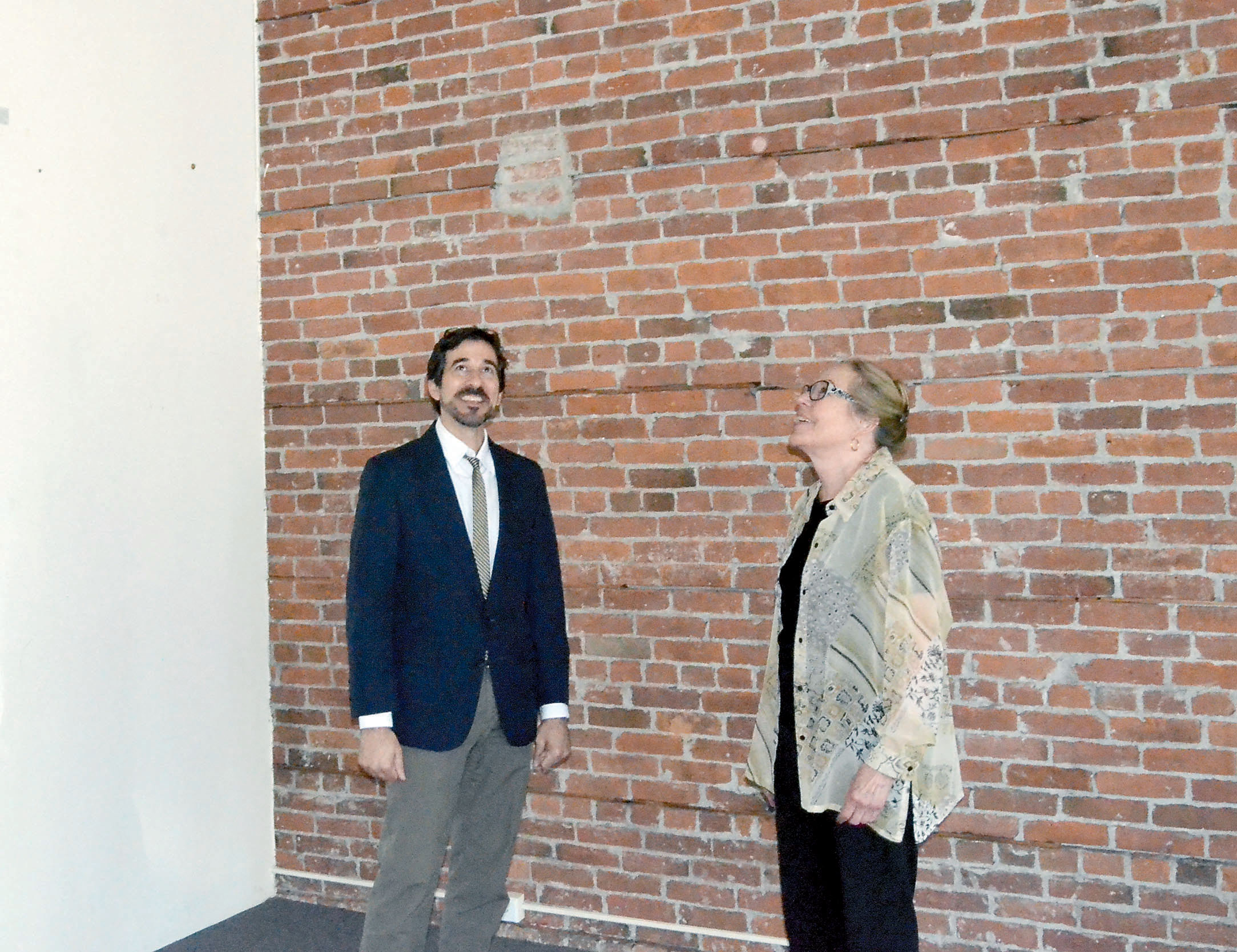 Northwind Arts Center Executive Director Michael DAlessandro and board chair Jeanette Best inspect the new downtown Port Townsend space the gallery hopes to take over in October.  Charlie Bermant/Peninsula Daily News