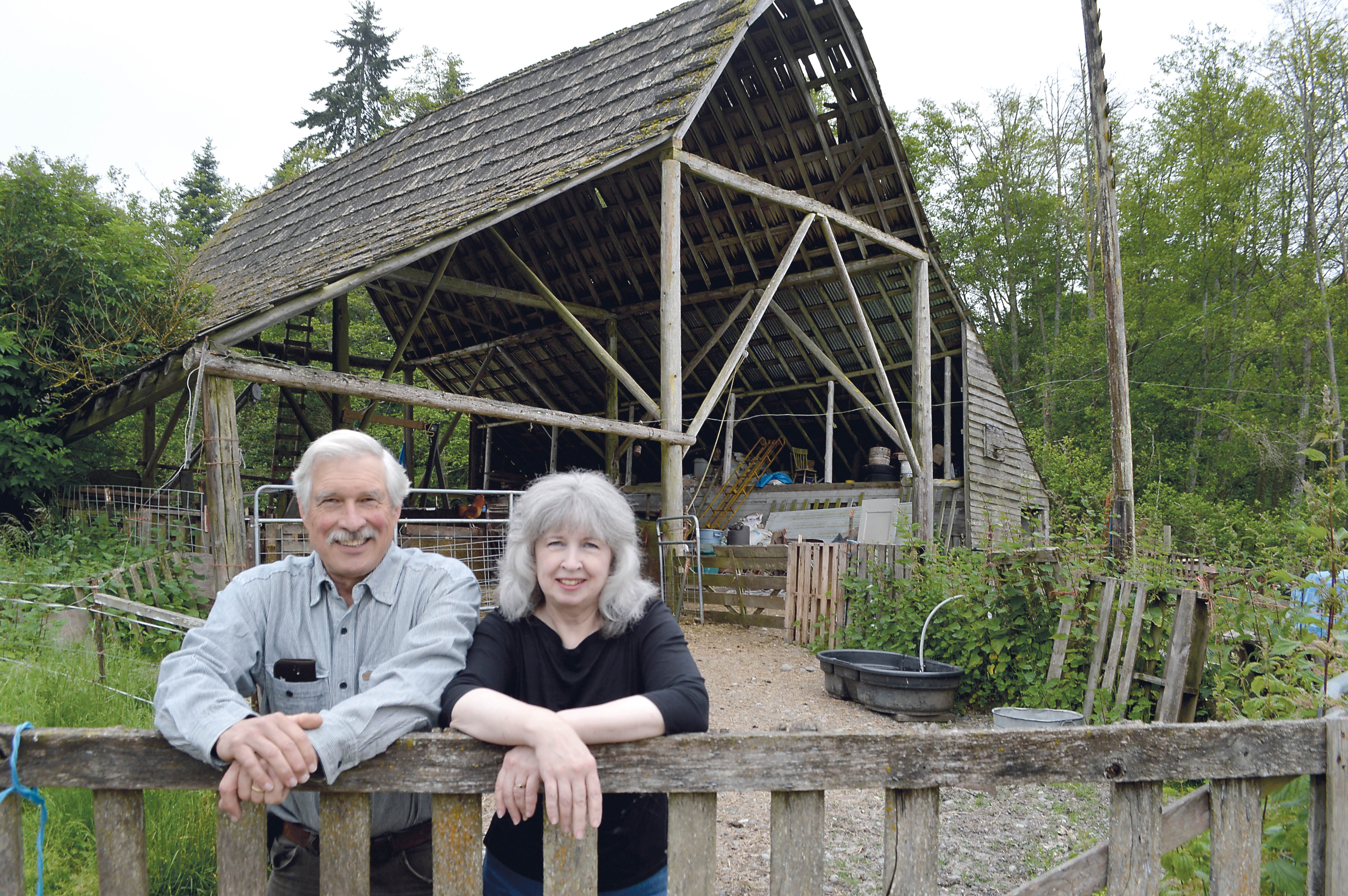 Paul and Deb Hansen will host a dance Friday to raise funds to help preserve their barn off Frost Road south of Carlsborg. The dance will be at the Sequim Prairie Grange Hall.  Joe Smillie/Peninsula Daily News
