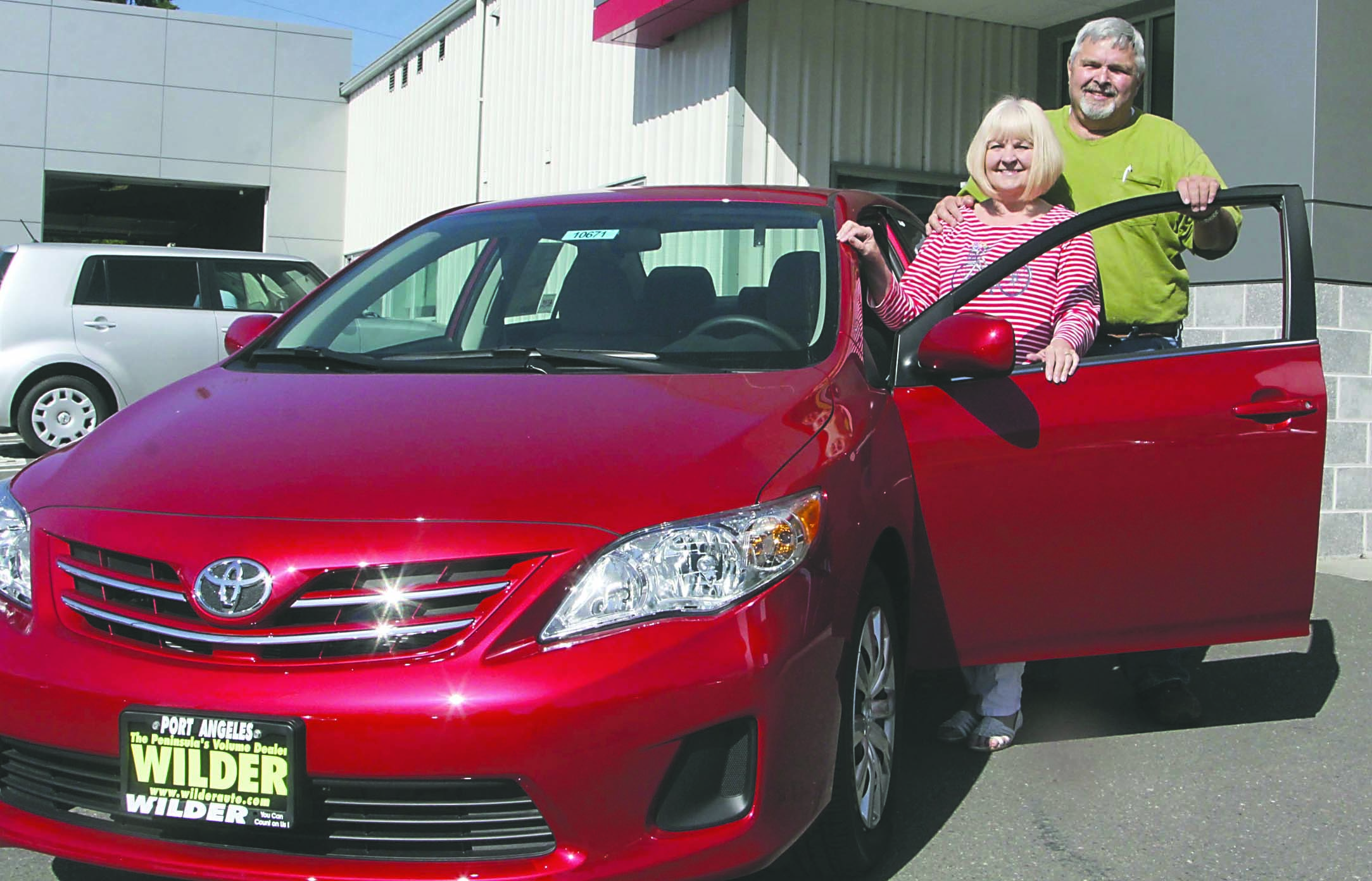 Rena and Bill Keith of Sequim chose a new Toyota Corolla as their reward for winning the top prize at the annual Great Olympic Peninsula Duck Derby in Port Angeles. Dave Logan/for Peninsula Daily News