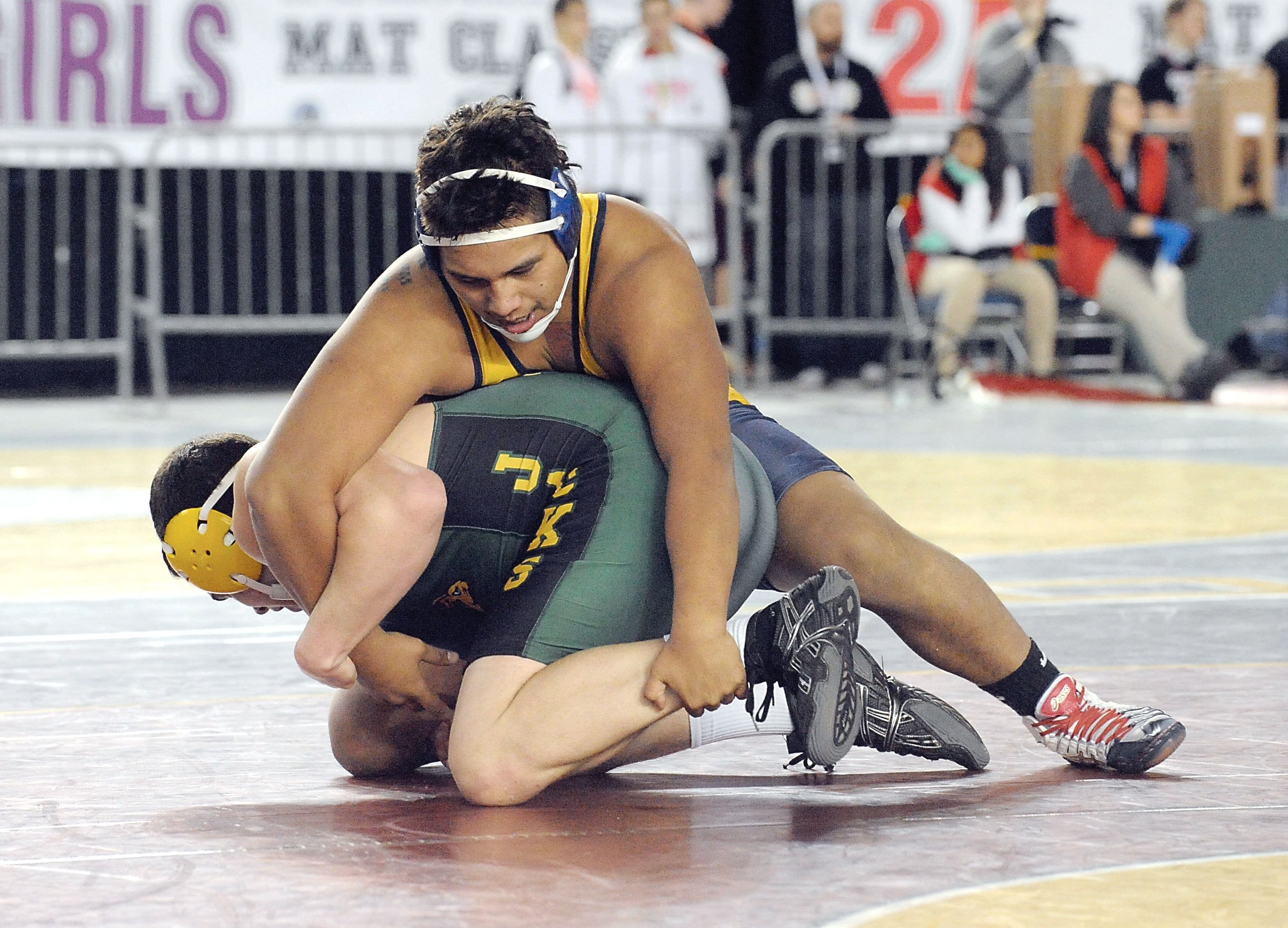 Forks senior Joel Ward wrestles Quincy's Austin Morris in the first round of the Mat Classic earlier this year. Ward went on to finish second in the 220-pound weight class. Lonnie Archibald/for Peninsula Daily News