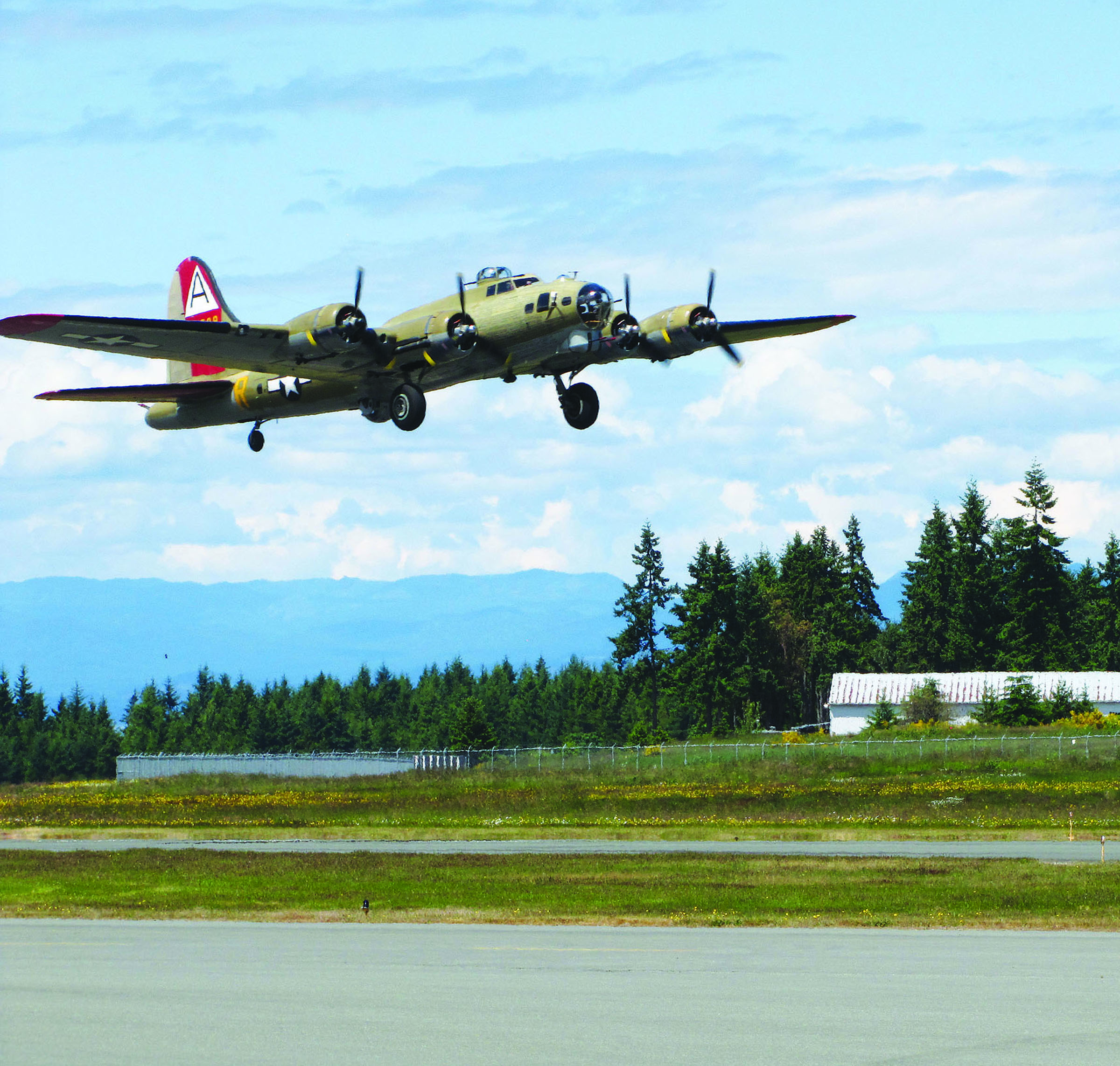 The visiting B-17 thats part of Wings of Freedom lands Monday at William R. Fairchild International Airport -- Photo by Arwyn Rice/Peninsula Daily News