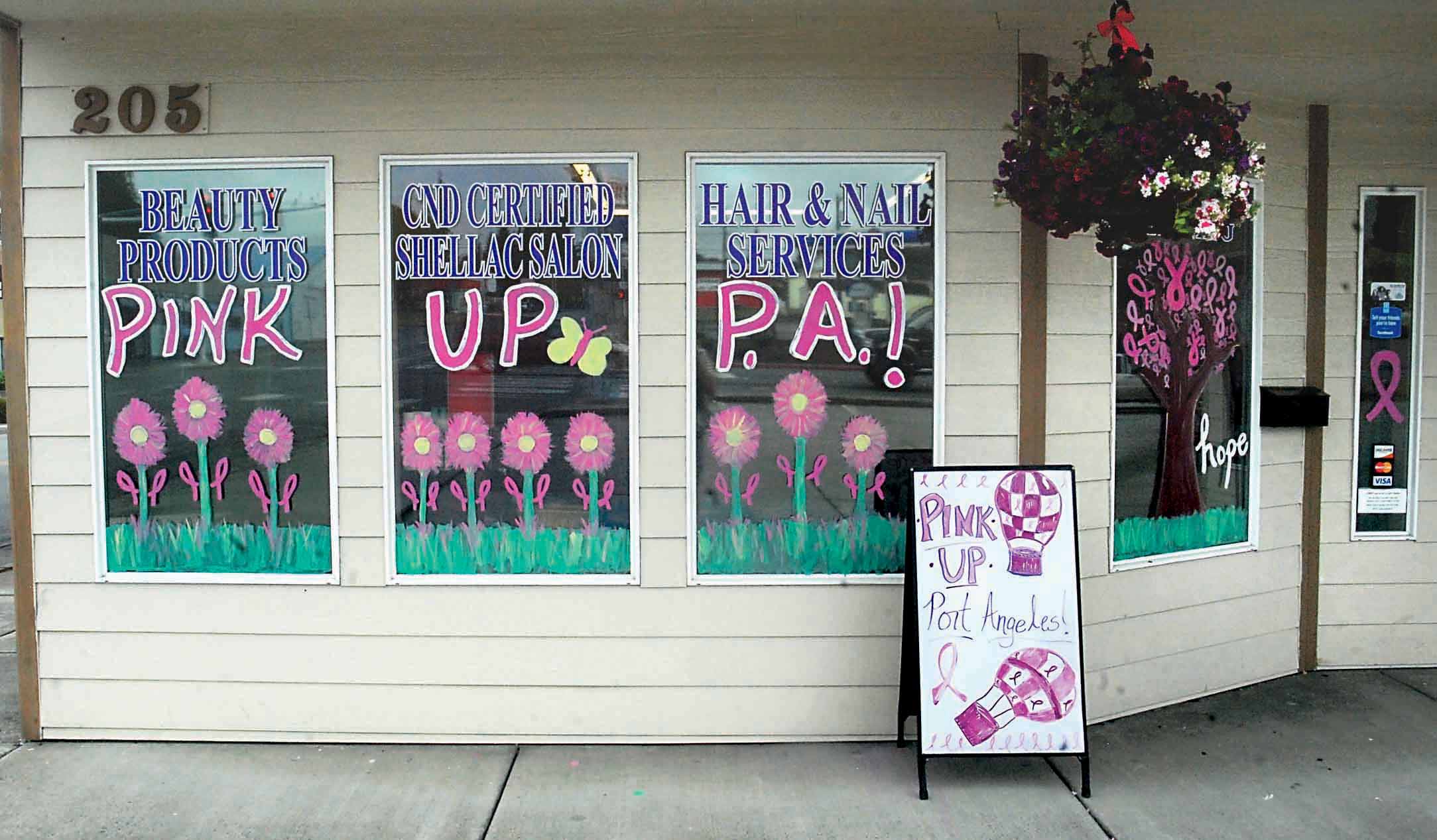 The front window of Angeles Beauty Supply & Salon was one of two decorated shop windows to take first place in the sixth annual Pink Up Port Angeles window contest. Keith Thorpe/Peninsula Daily News
