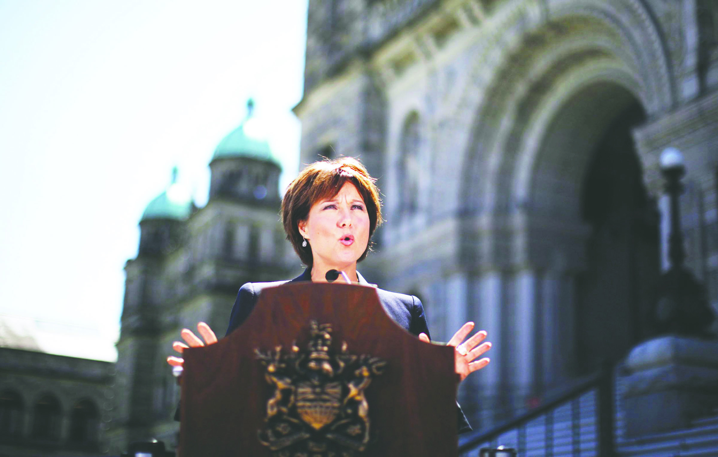 British Columbia Premier Christy Clark speaks to news media outside the British Columbia Legislative Buildings in Victoria today after two Canadian-born citizens were arrested in what police described as al-Qaida-inspired plot to blow up the legislature on Canada Day
